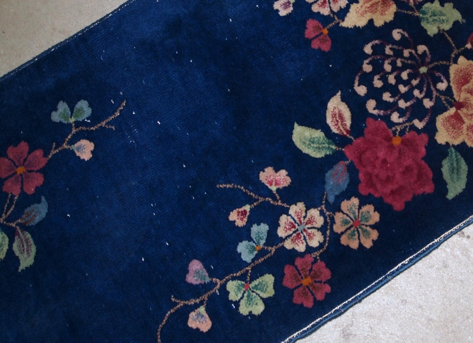 Hand made antique Art Deco Chinese rug in deep blue shade. The rug is in original condition, has some low pile.

-condition: original, some low pile,

-circa: 1920s,

-size: 2.1' x 4.1' (64cm x 125cm),

-material: wool,

-country of origin: