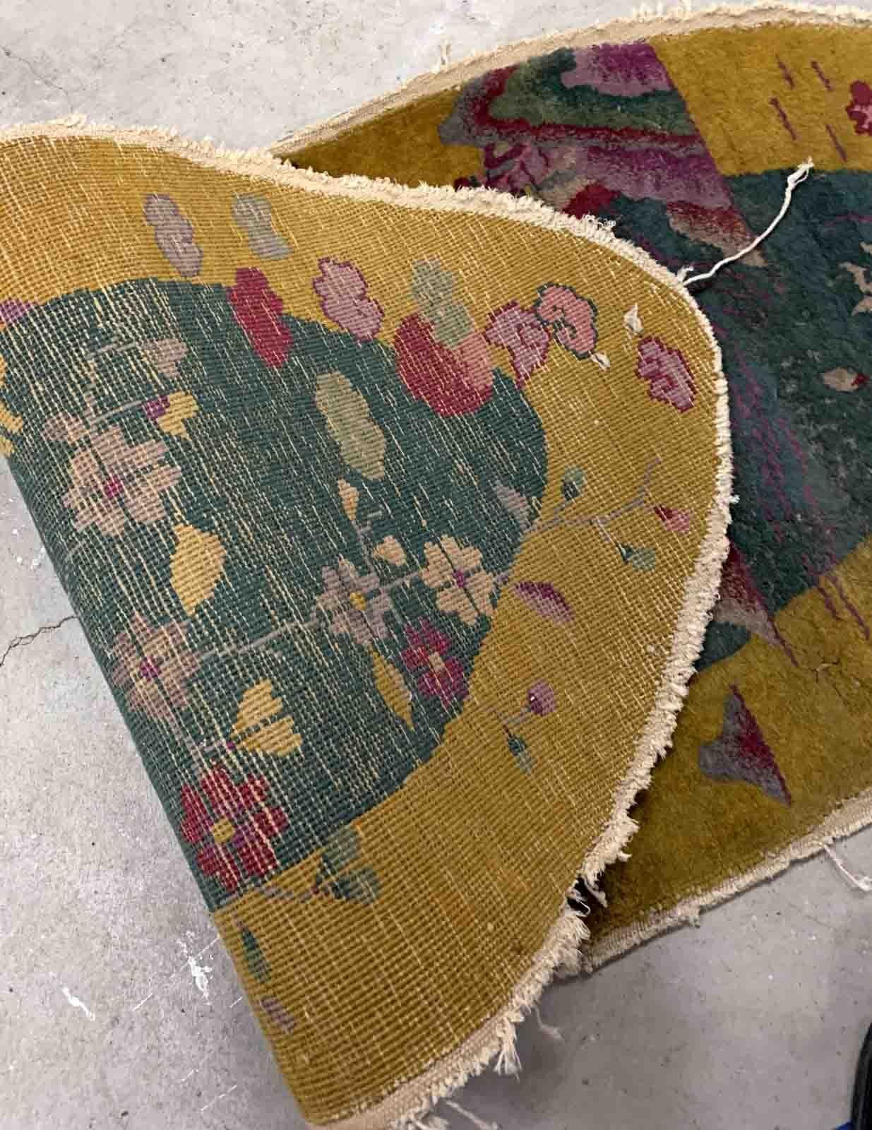 Handmade antique Art Deco Chinese rug in green and yellow shades. The rug is from the beginning of 20th century in original condition, it has some signs of age. 

-condition: original, has some signs of age,

-circa: 1920s,

-size: 2.1' x 5'