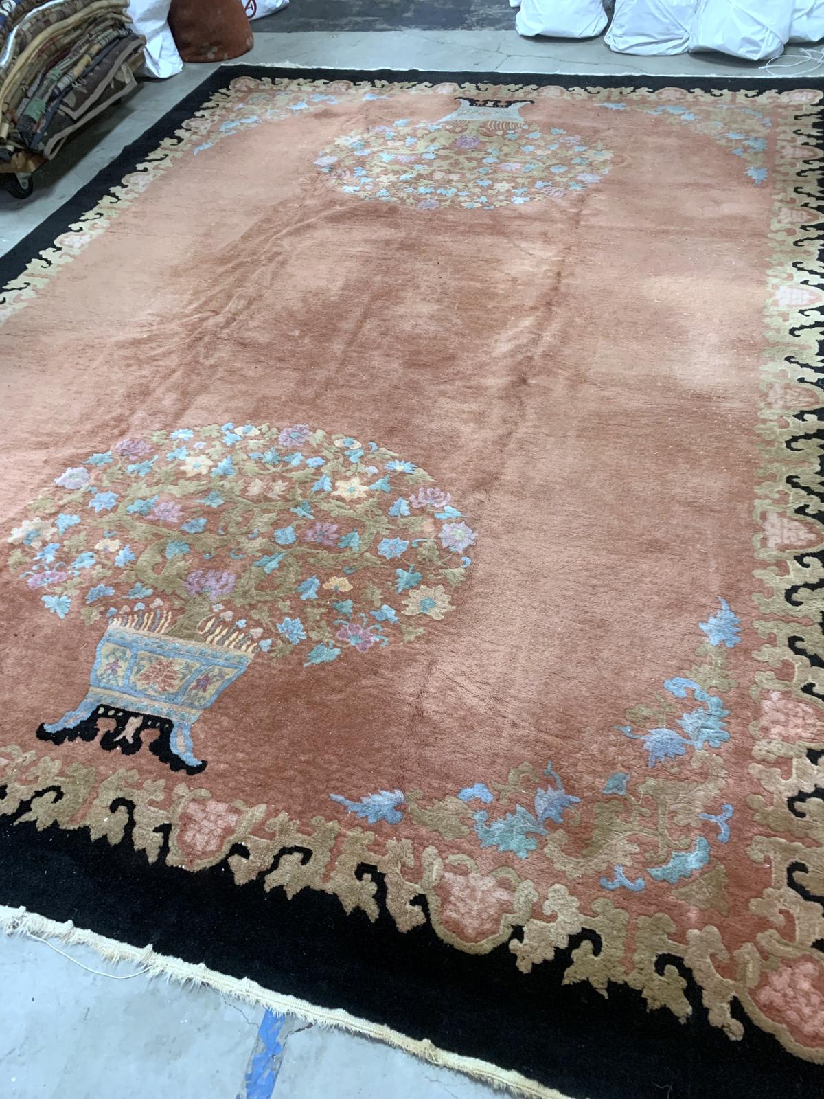 Handmade antique Art Deco Chinese rug in pink and black colors. The rug is from the beginning of 20th century in original condition, it has some low pile areas.

-condition: original, some low pile,

-circa: 1920s,

-size: 8.10' x 11.10'