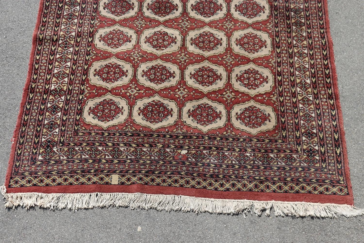 Beautiful early 20th century ( 1920s circa) antique Bokhara Rug  handmade in wool. This fantastic rug with four columns of small medallions. Used, good conditions.
   