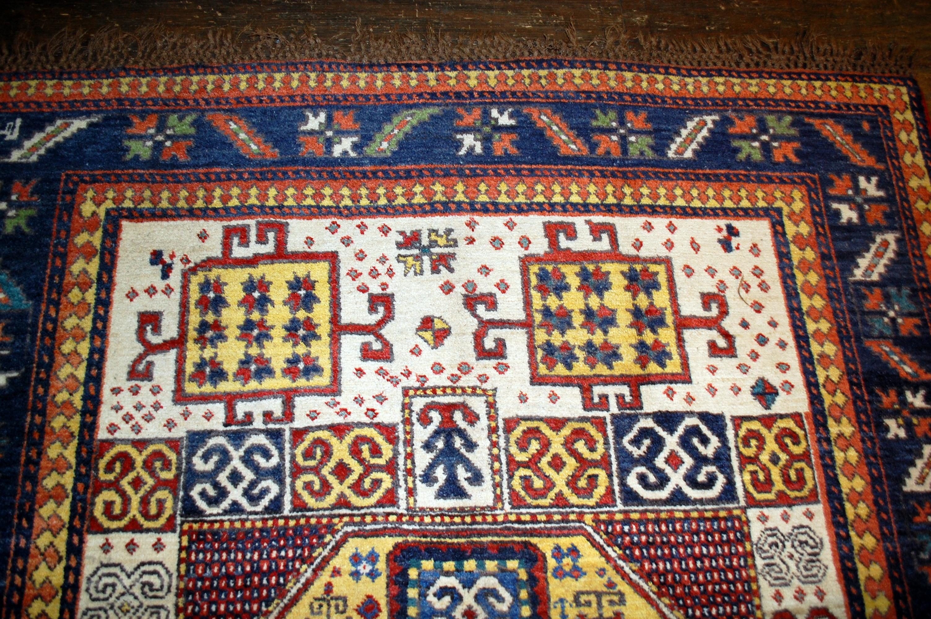 Antique handmade Caucasian Kazak Karachov rug in original condition. The rug made in tribal design with very interesting bright yellow medallion. 

-condition: original good, 

-circa 1940s,

-size: 5.9' x 7.9' ( 180cm x 241cm ),

-material: