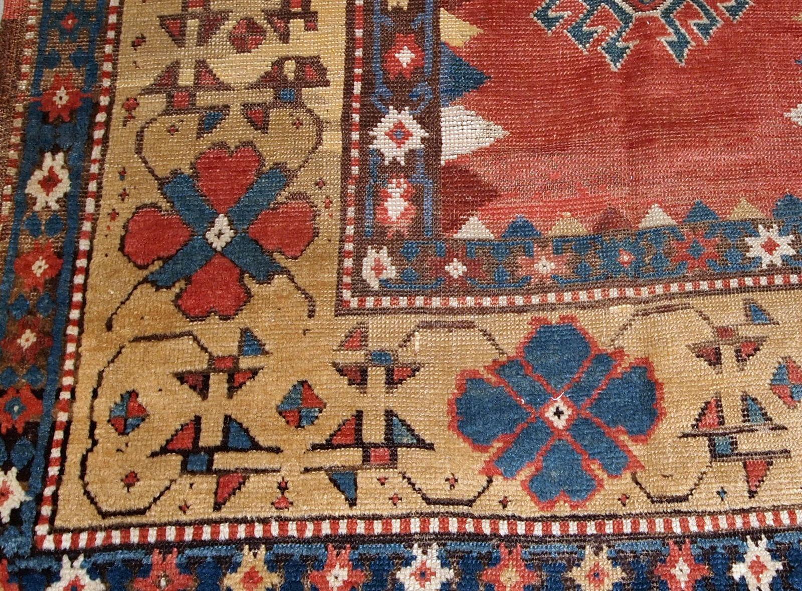 Handmade antique Caucasian Kazak rug in red and yellow shades. The rug is from the end of 19th century from Russia in original good condition.

-condition: original good,

-circa: 1880s,

-size: 3.5' x 6.1' (106cm x 186cm),

-material: