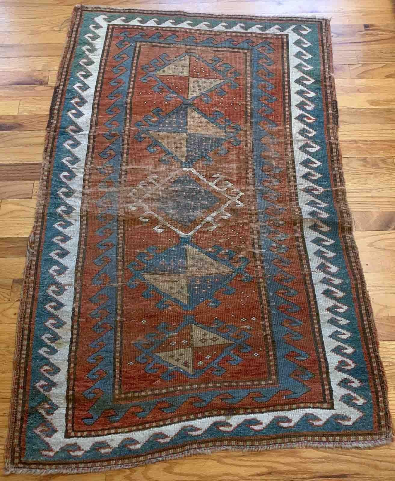 Handmade antique collectible Caucasian Kazak rug in natural dyes. The rug is from the end of 19th century in original condition, it has some age wear

-condition: original, some age wear,

-circa: 1880s,

-size: 2.7' x 4.2' (82cm x