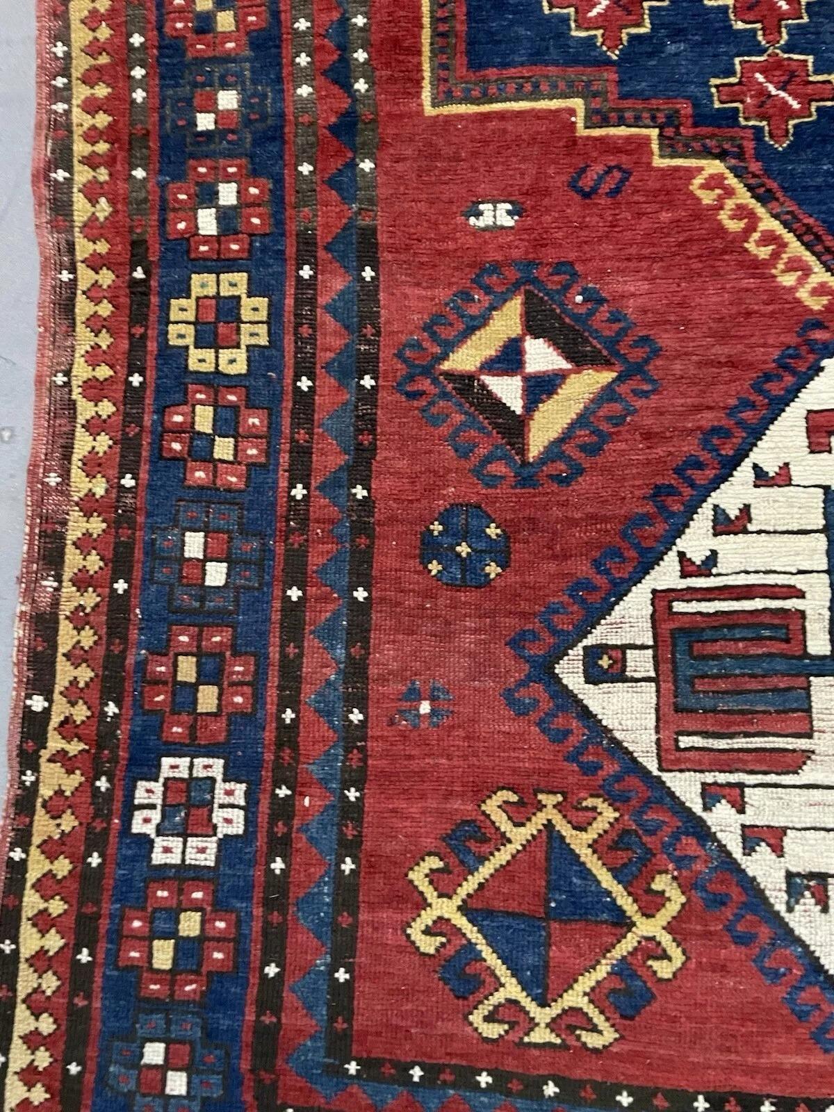 Antique Caucasian Lori Pambak Wool Rug, Circa 1880s
This exceptional antique Caucasian Lori Pambak rug, hand-knotted in the 1880s, is a true masterpiece of nomadic weaving. The rug features a bold and striking design with a central medallion flanked