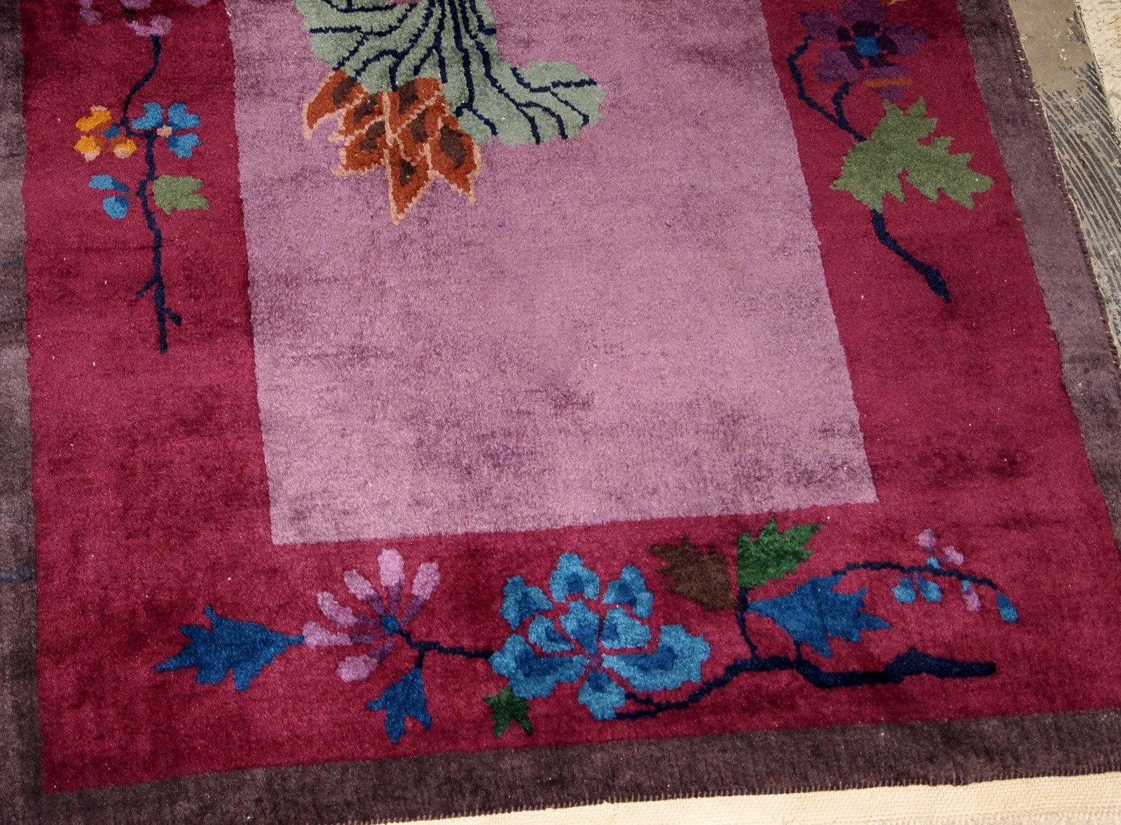 Handmade antique Art Deco Chinese rug in purple shade. The rug has some bright shades of green, blue and brown as well. It is in original good condition. 

- Condition: Original good,

- circa 1920s,

- Size: 2.7' x 4.4' (82 cm x 134 cm),

-