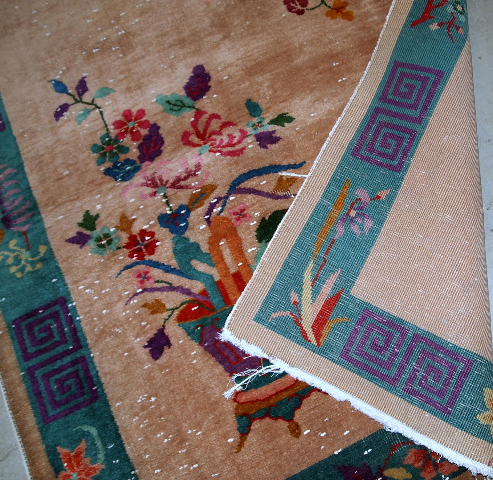 Handmade antique Art Deco Chinese rug in peach shade and decorative vase design. The rug is in original condition.
 

 