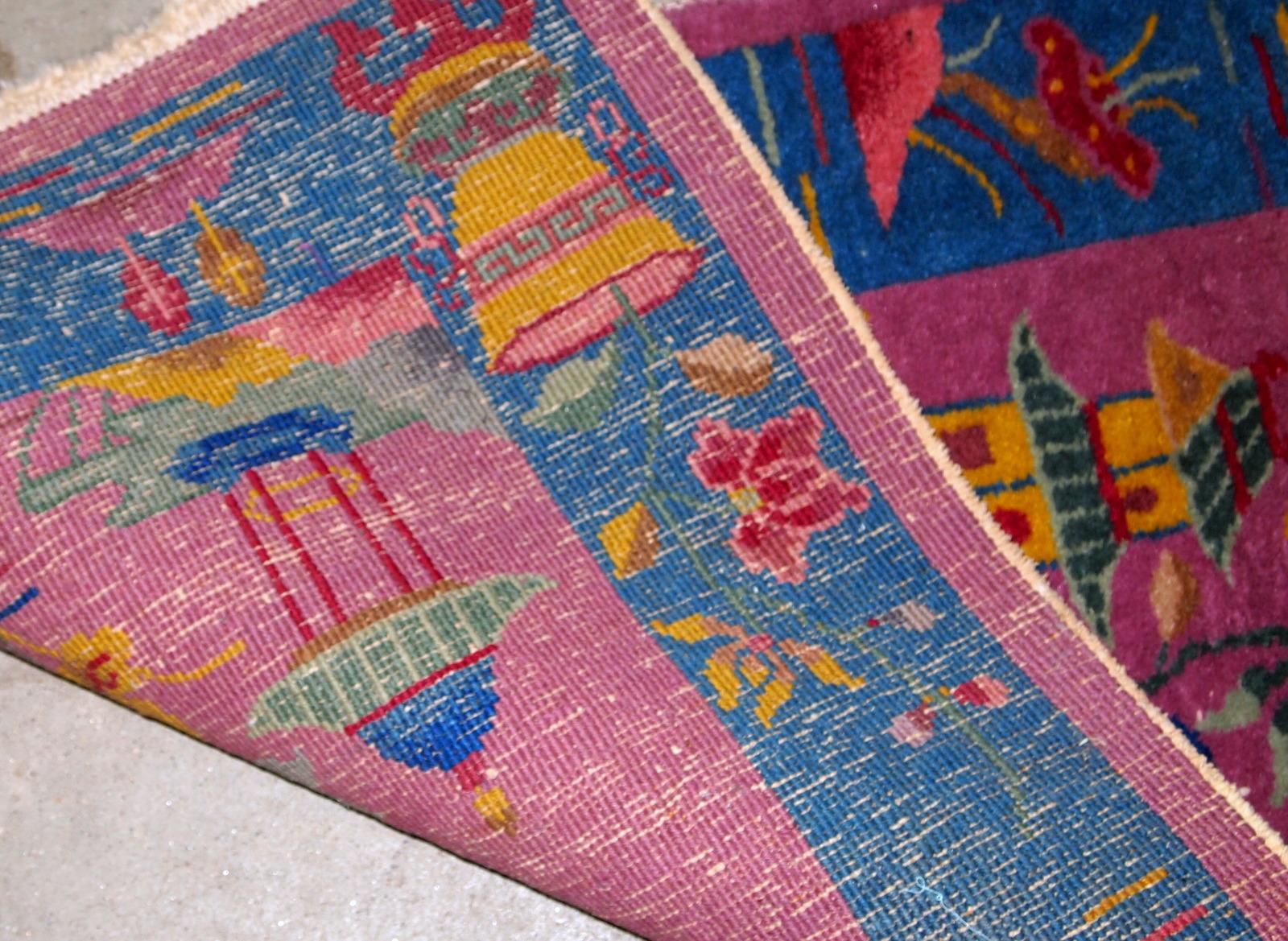 Handmade antique Art Deco Chinese narrow rug. The rug is in original good condition, from the beginning of 20th century.

- Condition: original good,

- circa 1920s,

- Size: 2' x 4.10' (61cm x 150cm),

- Material: wool,

- Country of