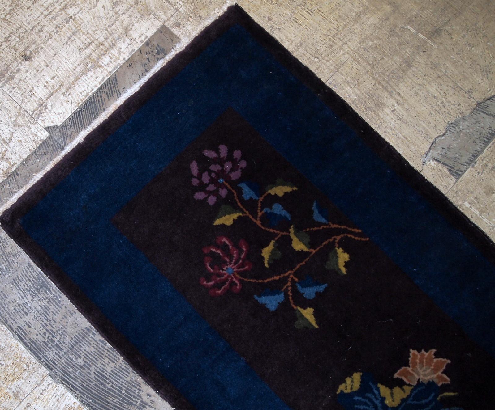 Handmade antique Art Deco Chinese rug in chocolate brown and night blue shades. The rug decorated in Art Deco floral design with bright colors. It is in original good condition. 



