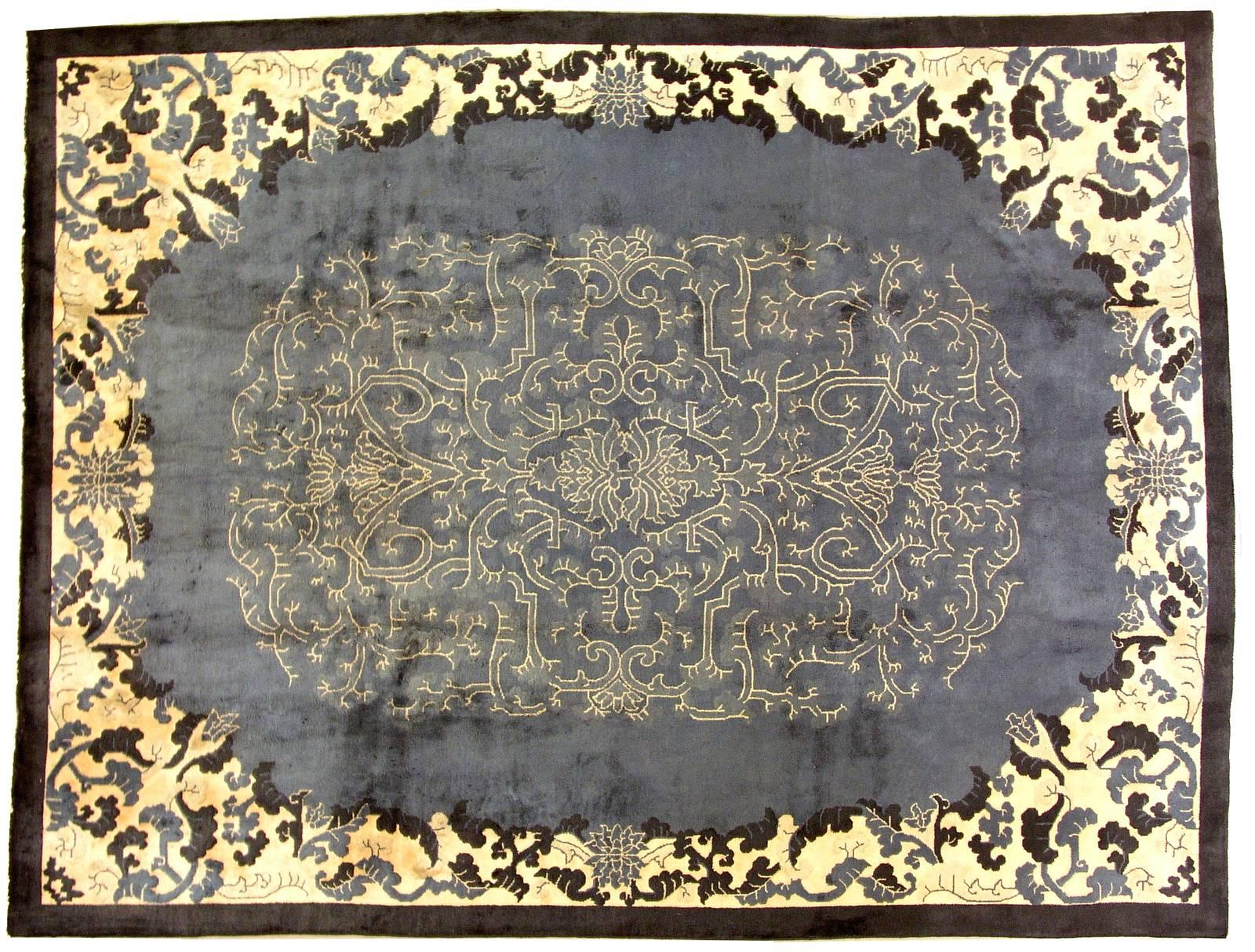 Handmade antique Art Deco Chinese rug in original condition. The rug has allover design with very nice Art Deco pattern on the background. Dirty blue shade as the background with bright beige border and design with yellowish shadow on it. The rug is