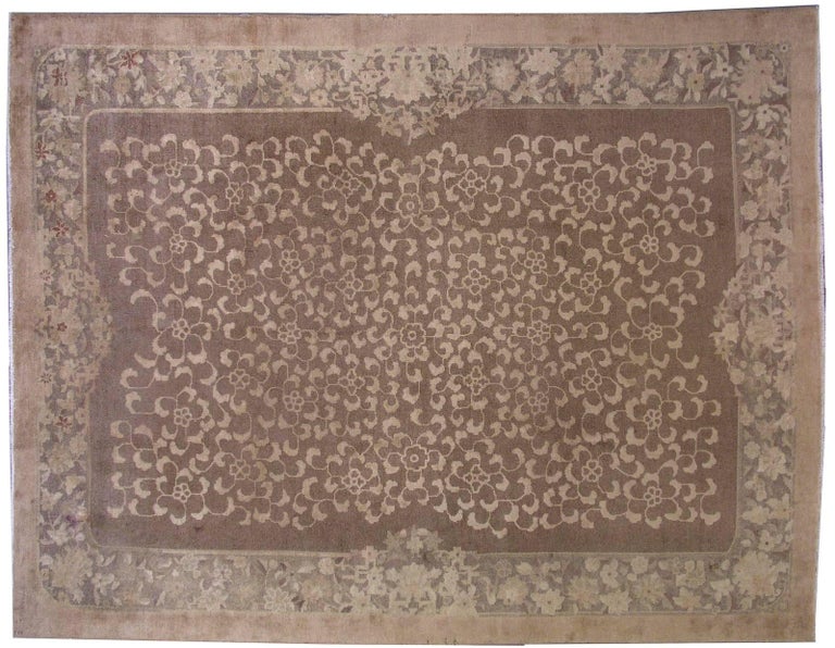 Antique Fete Chinese rug in original condition. The rug has very beautiful all-over design. The rug is in different shades of brown. Very busy repeating design decorating the middle part of the rug. The border has some floral design and completing
