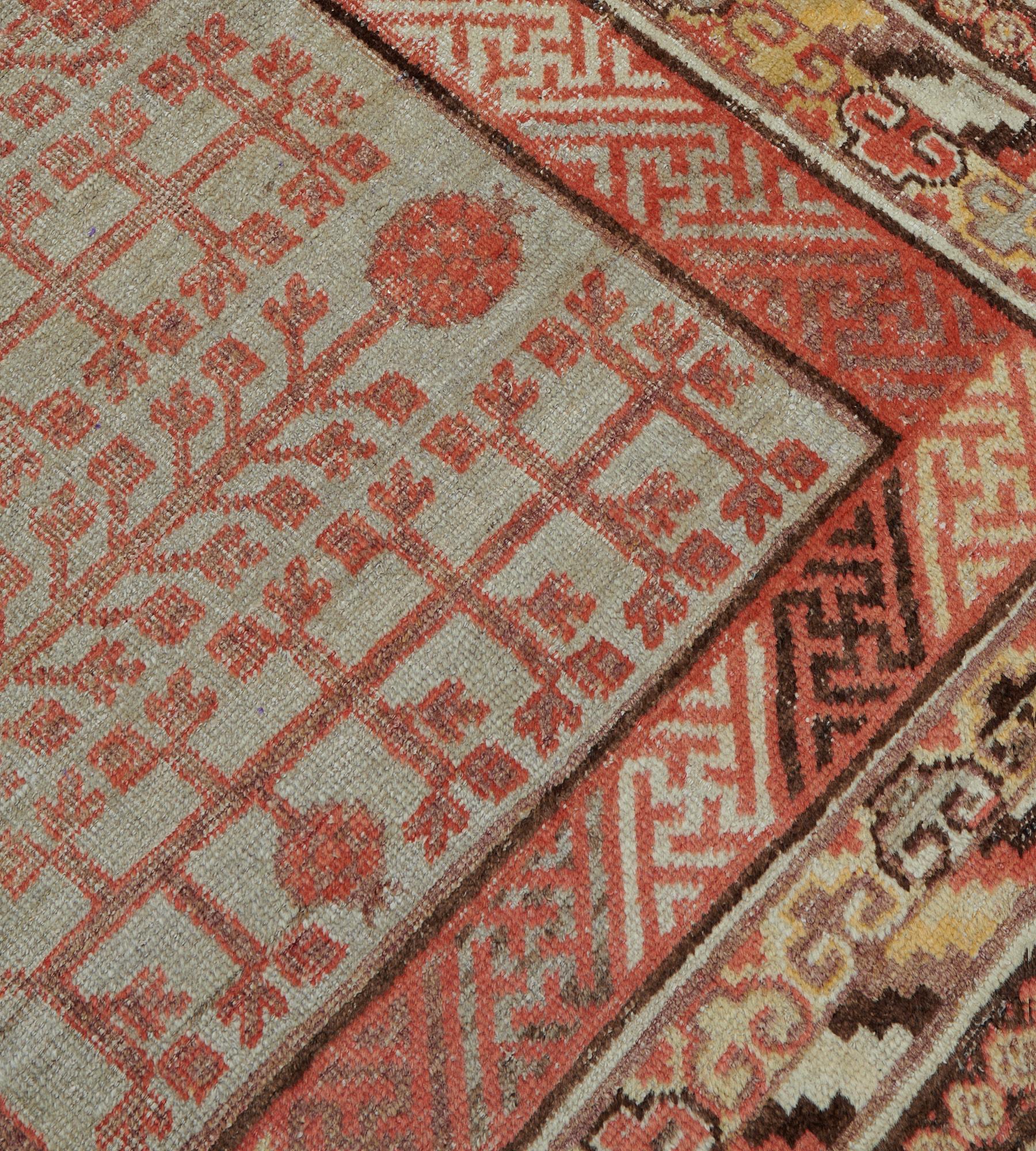 Hand-Woven Handmade Antique Circa-1880s Wool Pomegranate Khotan Rug  For Sale