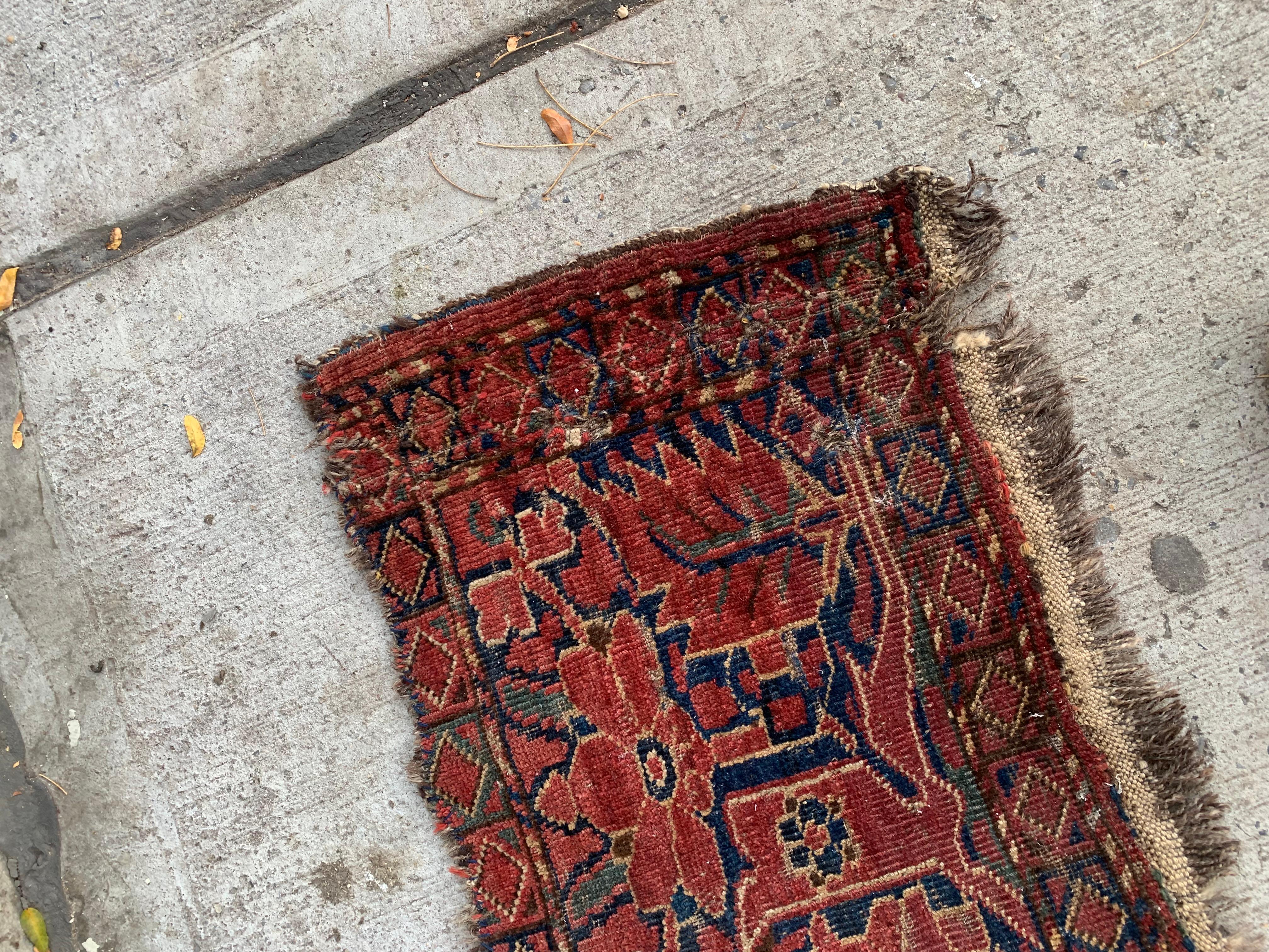 This handmade antique Afghan Ersari Torba rug, crafted in the 1870s, is a rare and collectible piece that showcases the remarkable artistry and cultural heritage of the Ersari tribe. Its compact size and intricate design make it a unique addition to