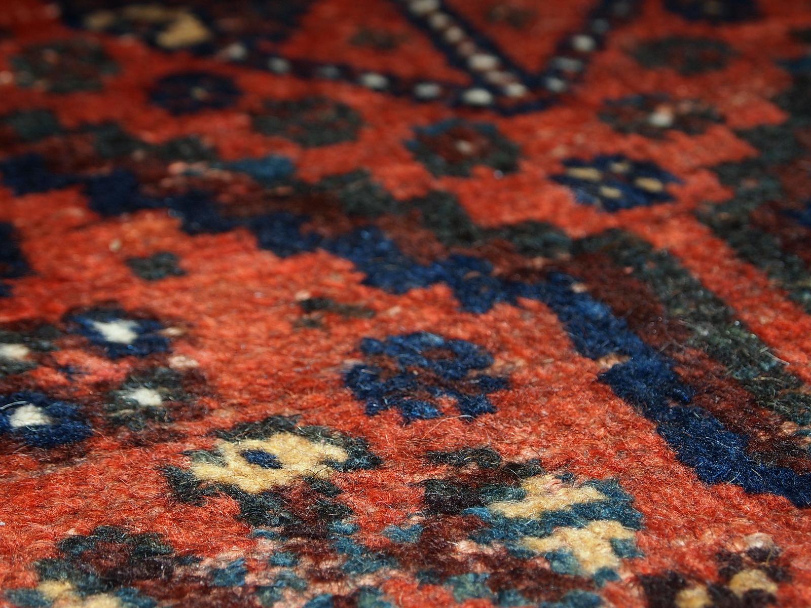 Antique collectible Shiraz Style rug in original condition, it has some signs of age. The rug is in 3 main shades: Navy blue, bright red and white. Measures: 2.9' x 3.1' (88cm x 97cm).