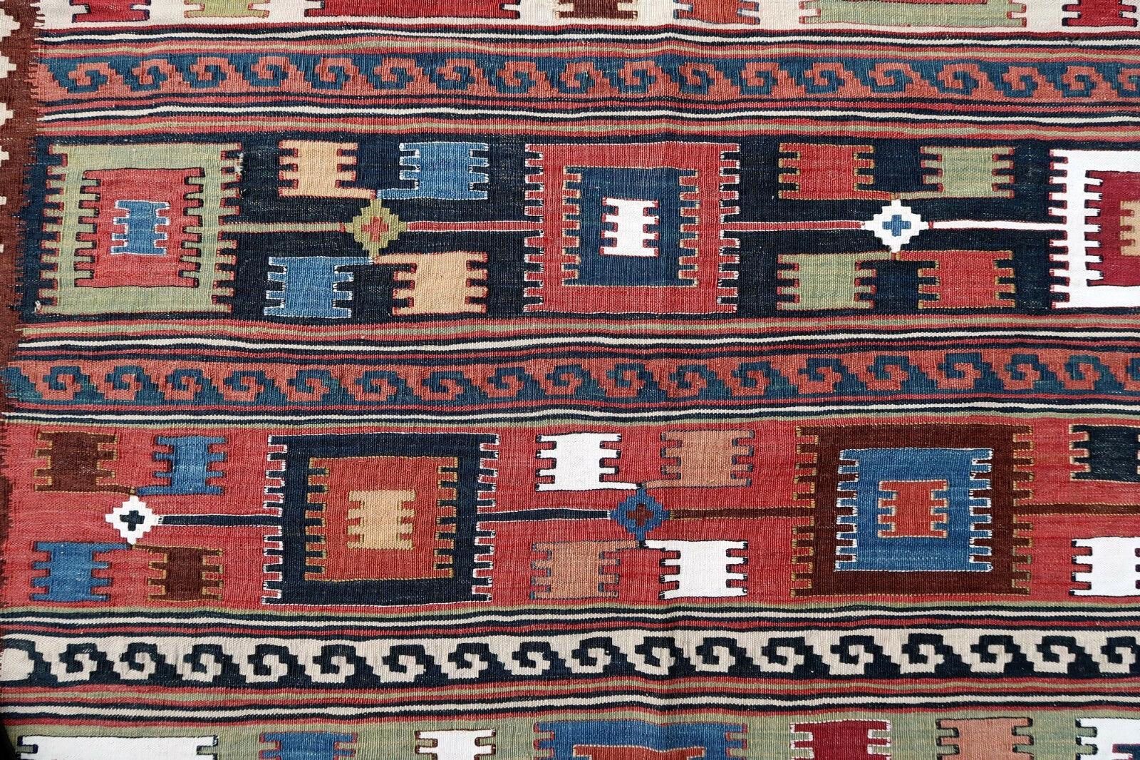 Antique Gashkai kilim from Middle East in colorful shades. The rug is from the beginning of 20th century in original condition.

-condition: original, some signs of age,

-circa: 1900s,

-size: 4.7' x 11.5' (143cm x 350cm),

-material: