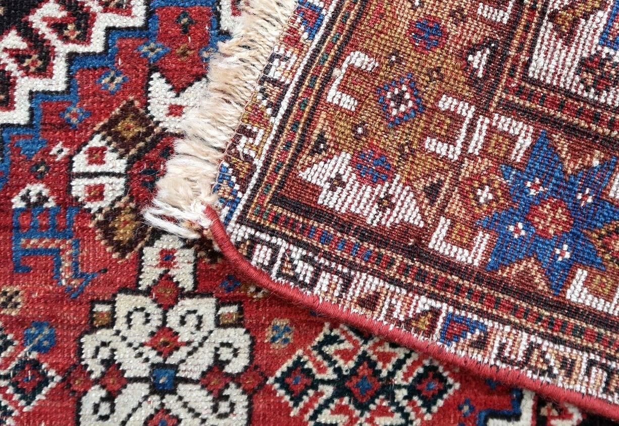 Handmade antique Gashkai rug from the beginning of 20th century. The rug is in original condition (distressed) made in colorful shades of wool.

- Condition: Original, low pile, age wear, old restoration,

- circa 1900s,

- Size: 2.9' x 5.4'