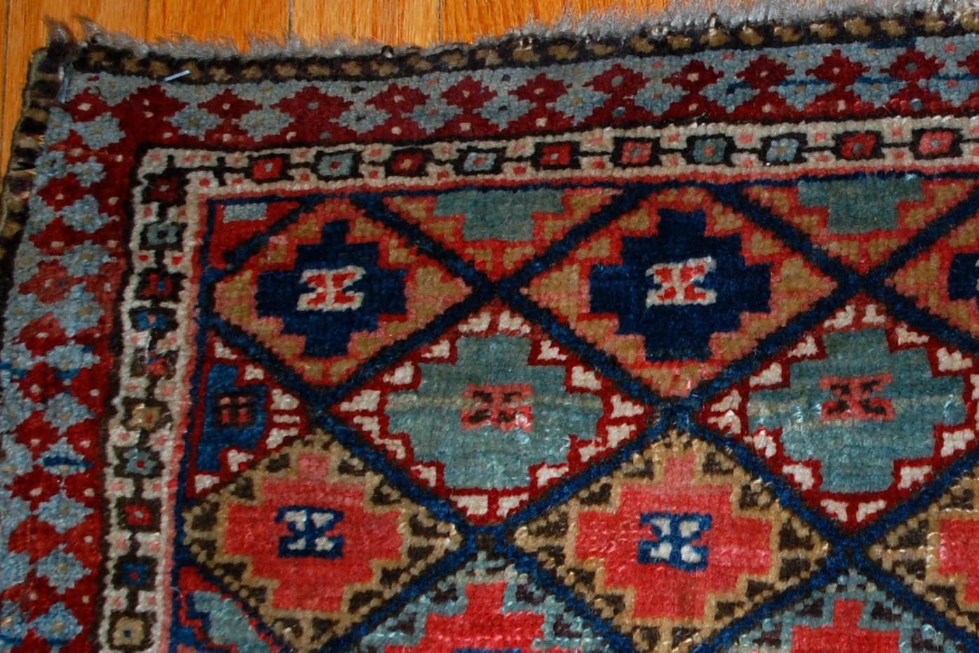 Handmade antique collectible Kurdish bag face in geometric design with colorful background and geometric design . Very interesting border sky blue border with burgundy accent on it. The bag face is in original good condition.

-condition: original