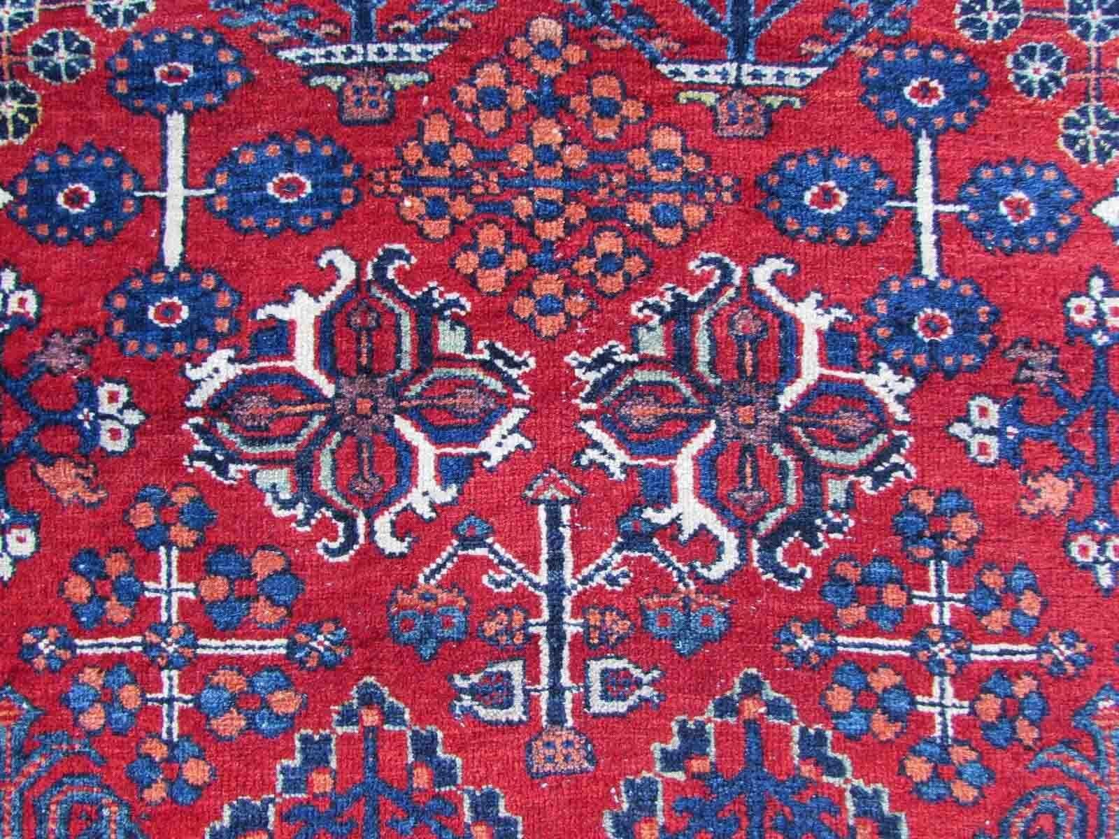 Handmade antique Joshagan rug in bright red color. The rug is from the beginning of 20th century mostly in original good condition, it has some low pile

-condition: original good, some low pile,

-circa: 1920s,

-size: 4.1' x 6.6' (128cm x