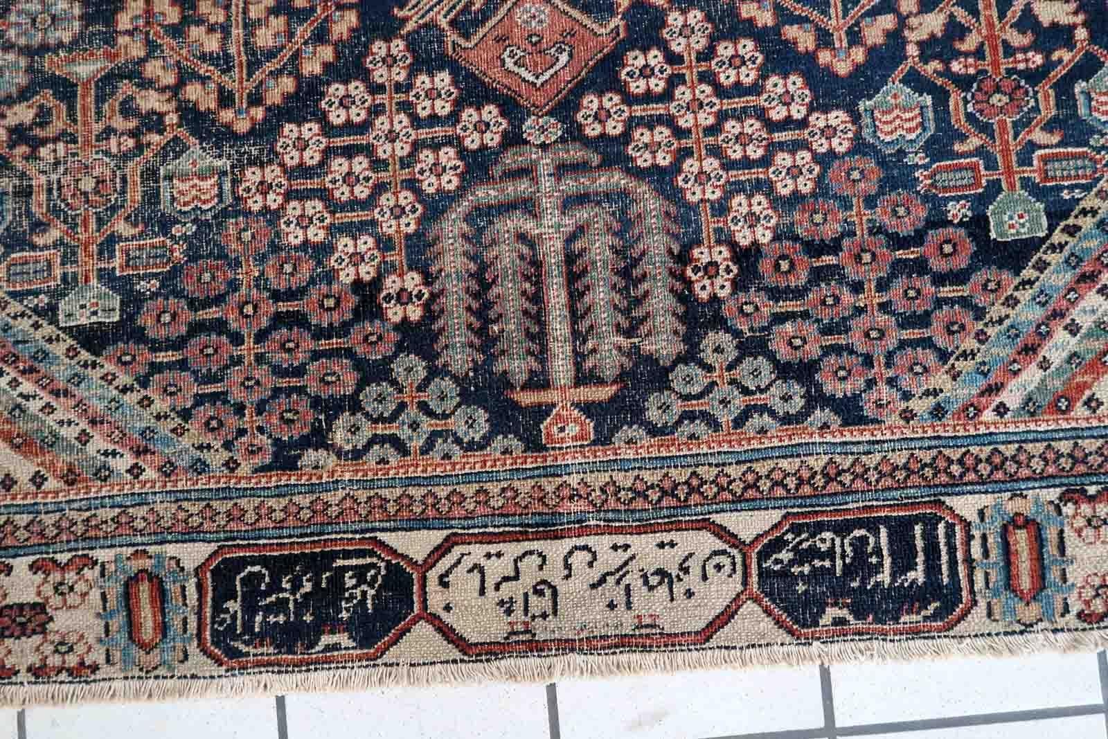Handmade antique Jozan rug in traditional design and night blue color. The rug is from the beginning of 20th century in distressed condition. On the sign it says 1335 year by Islamic calendar, it is 1915th year.

-condition: distressed,

-circa: