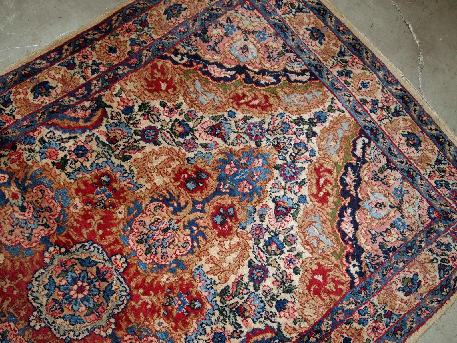 Handmade antique Kerman rug from Middle East in colourful shades. The rug is in original good condition.

?-condition: original good,

-circa 1910s,

-size: 4.1' x 5.4' (125cm x 164cm),

-material: wool,

-country of origin: Middle