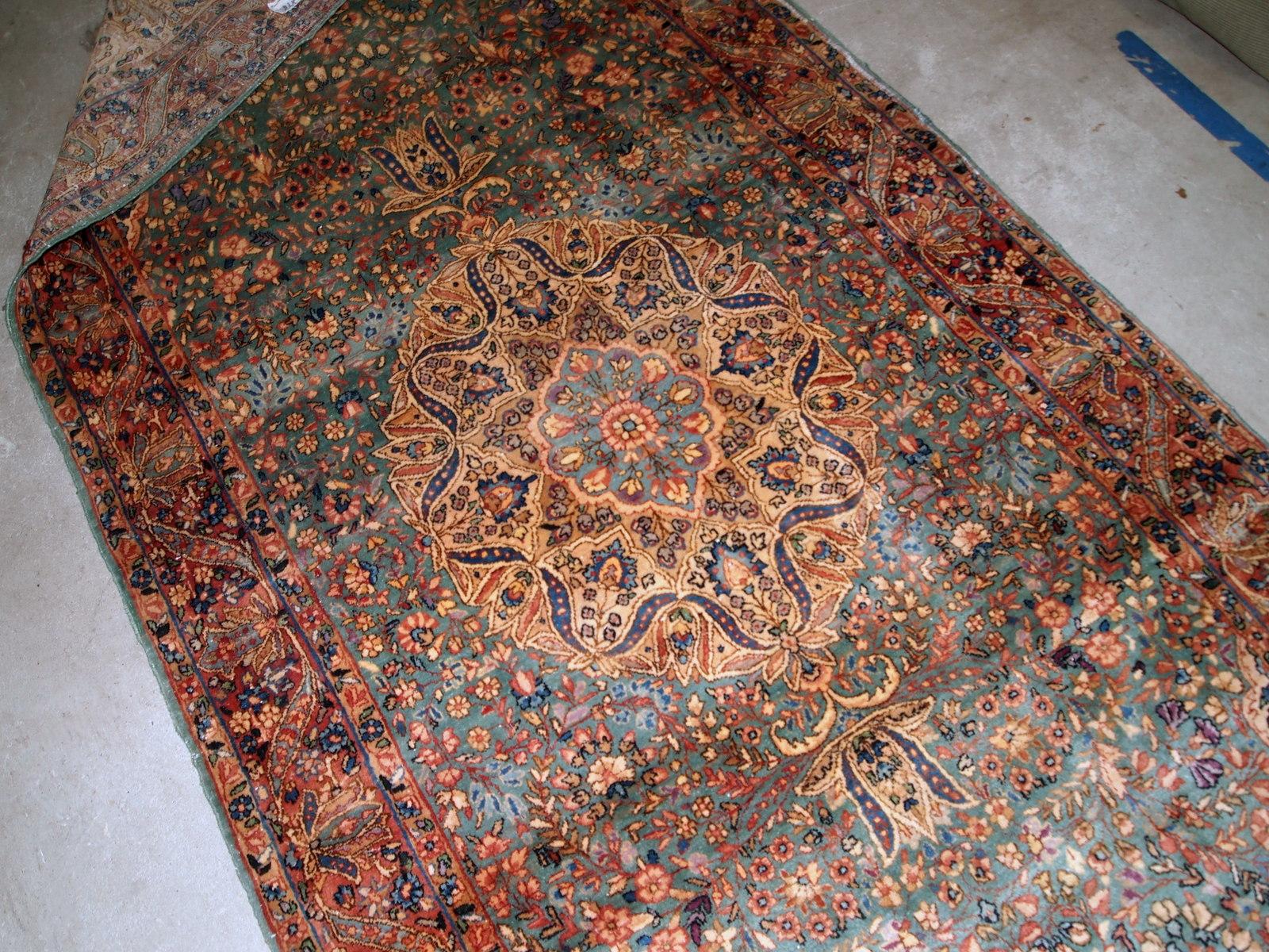 Handmade antique Kerman rug in original good condition. The rug has been made in the beginning of 20th century in sea green/blue wool.

- Condition: original good,

- circa 1920s,

- Size: 3.10' x 9' (120cm x 274cm),

- Material: wool,

-