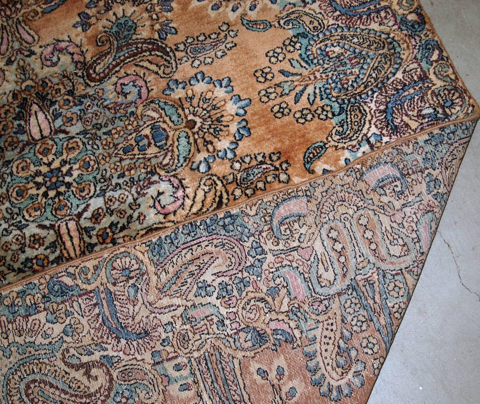 Antique handwoven Kerman rug in original good condition. The rug is from the beginning of 20th century.

-condition: original good,

-circa 1920s,

-size: 4.1' x 6.10' (125cm x 211cm ),

-material: wool,

-country of origin: Middle