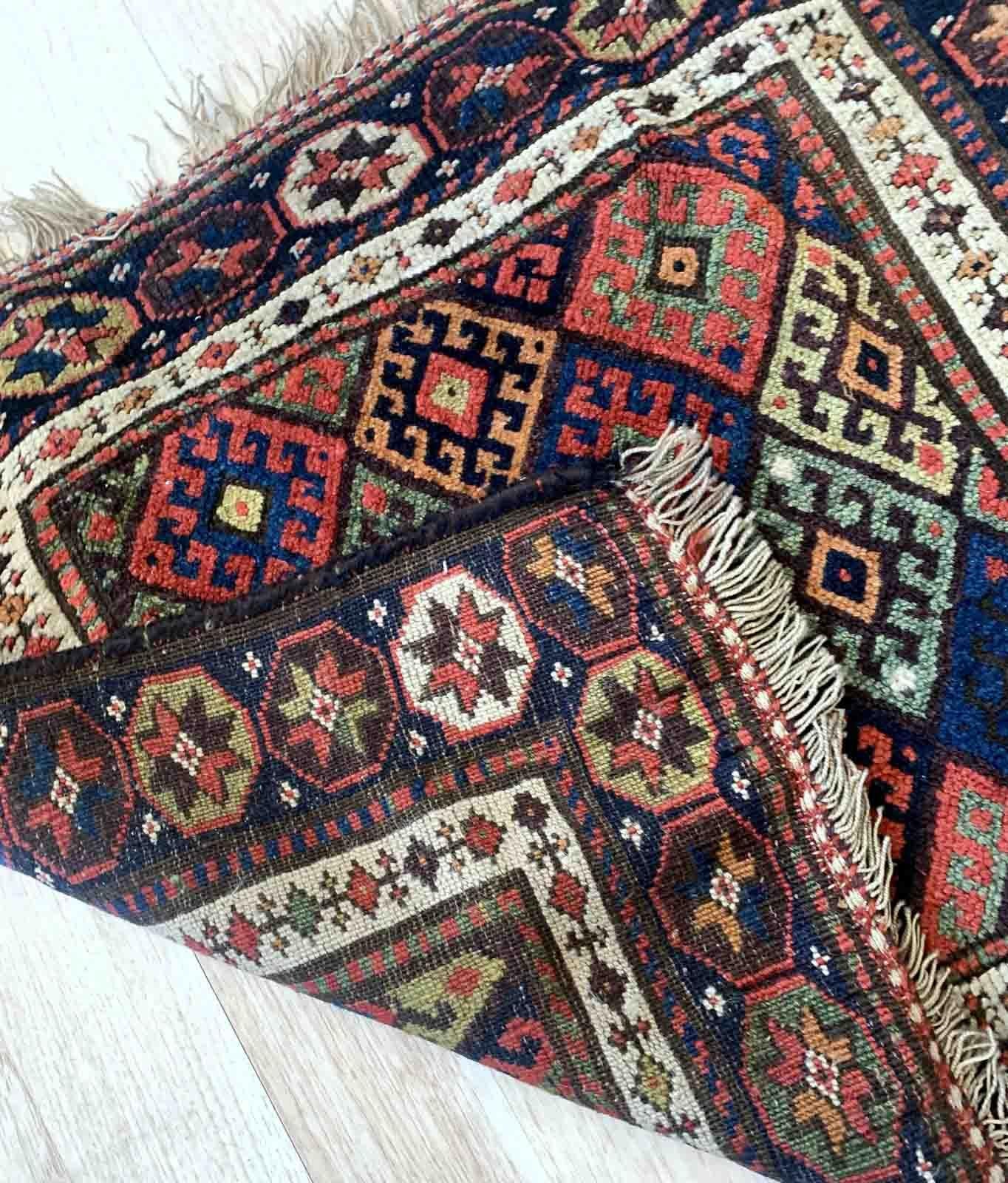 Handmade antique Kurdish jaf bag face in original good condition. The rug has been made in the end of 19th century in Persia. All dyes on the bag face are natural. This rug is collectible piece.


?-condition: original good,

-circa: