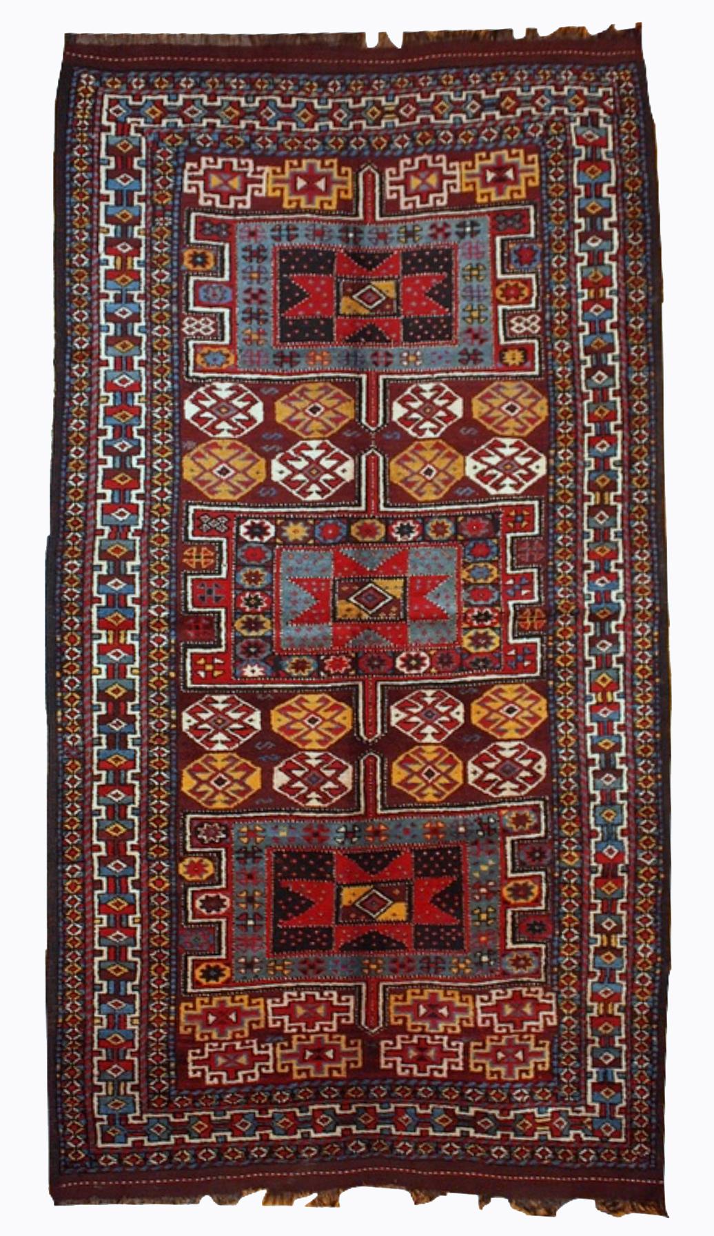 Antique Kurdish style rug in deep burgundy colour with some golden, white and sky blue shades. This rug is in original good condition. Measures: 4' x 8' (122cm x 243cm).