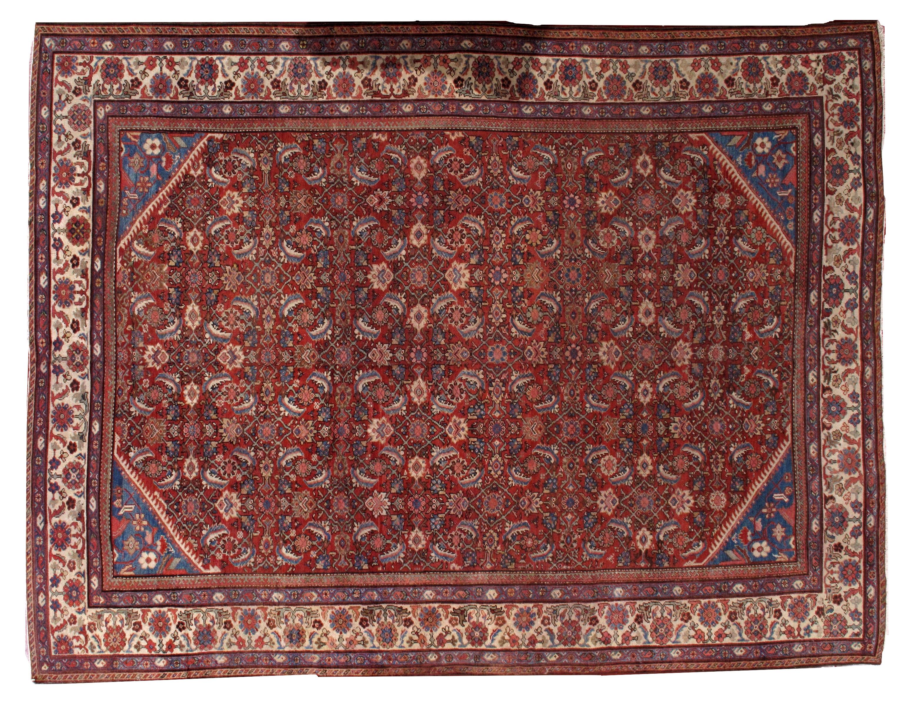 Tapis persan antique Mahal en bon état, couleur rouge vif avec quelques accents bleus et crème.