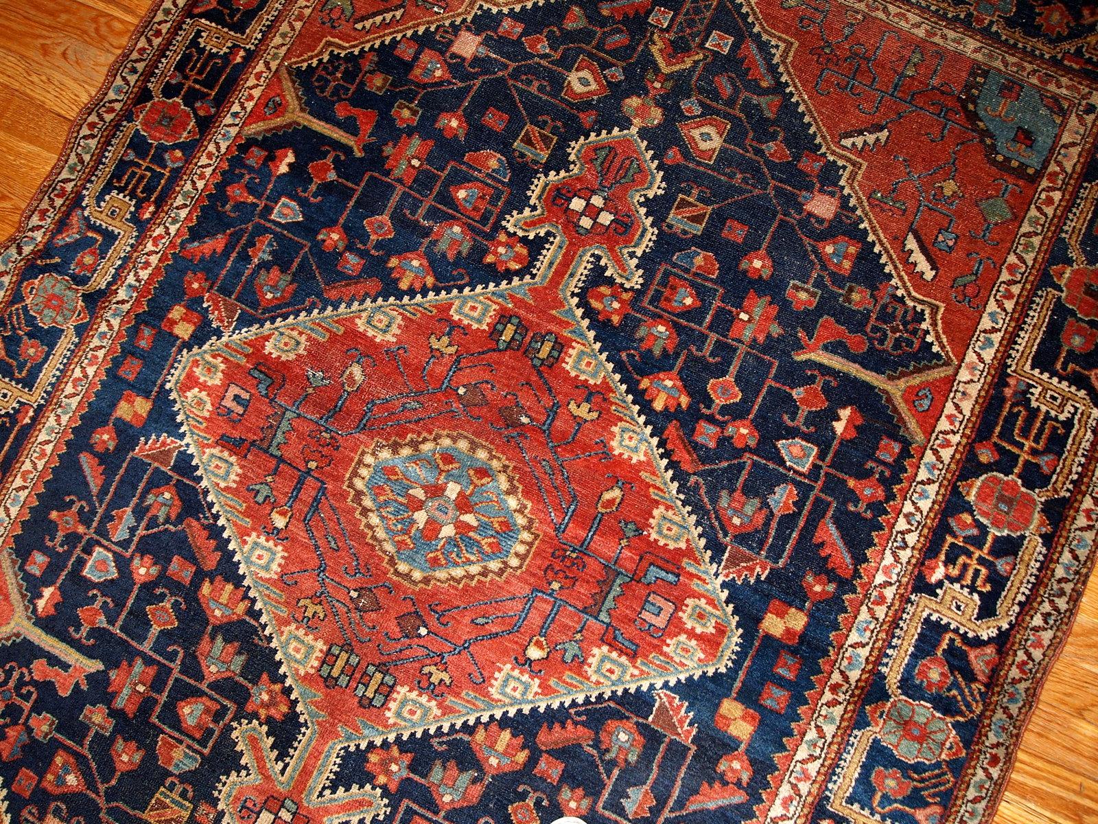 Antique handmade Malayer rug in navy blue and red shades. This rug is in original good condition.

-condition: original good,

-circa: 1920s,

-size: 4.10' x 7.3' (150cm x 222cm),

-material: wool,

-country of origin: Persia,

-style: