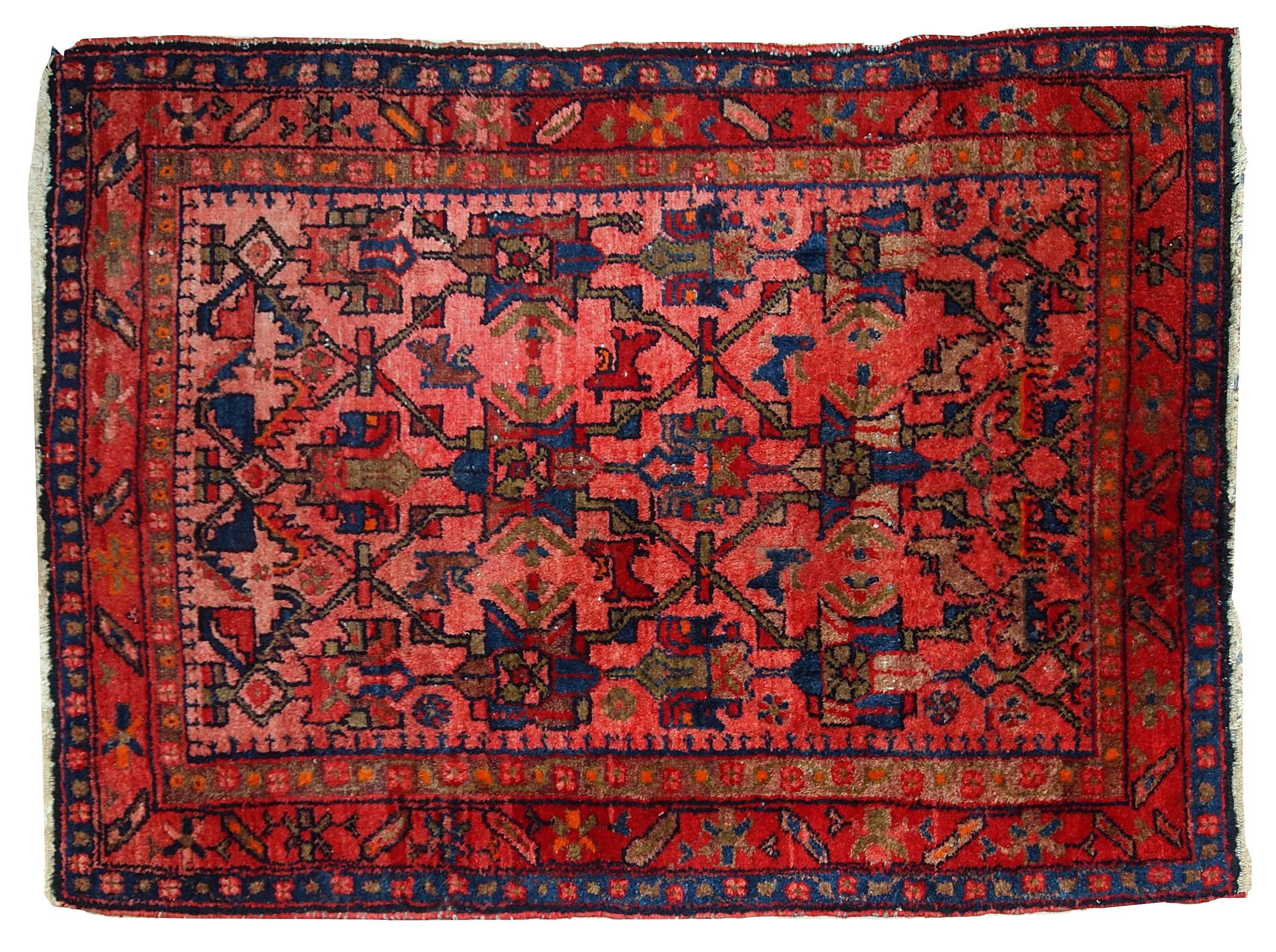 Handmade antique Malayer style rug in original good condition. The main colors of this rug are variety of red shades. The details of the tribal ornaments on it are in navy blue and olive shades. Measures: 3.7' x 5' (113cm x 153cm).