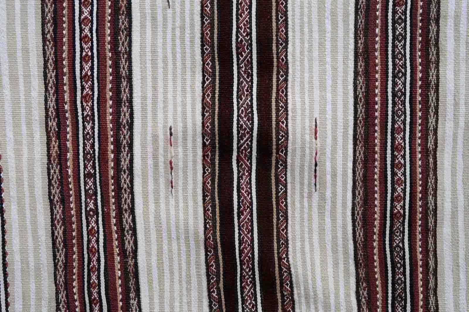 Handmade antique Moroccan Berber kilim from the middle Atlas region. The flatweave is from the beginning of 20th century in original condition, it has some signs of age.

-condition: original, some signs of age,

-circa: 1900s,

-size: 2.9' x