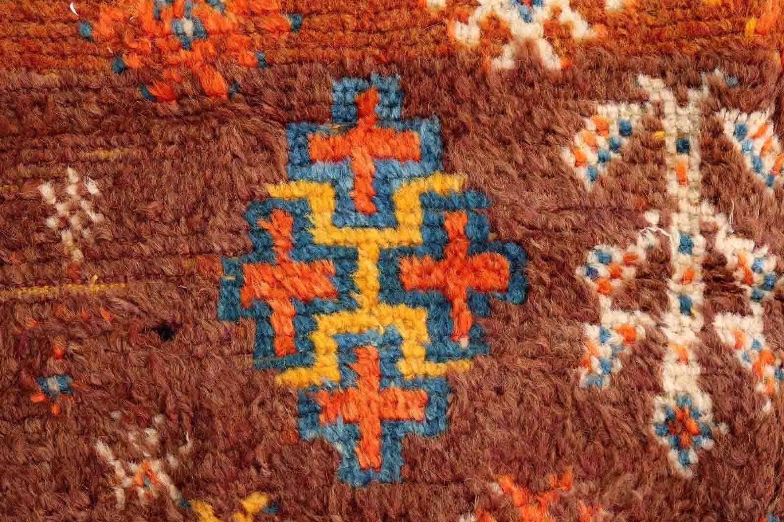 Handmade antique Moroccan Berber rug in rusty red shade and tribal design. The rug is from the beginning of 20th century in original condition, it has some age wear.

-condition: original, some age wear,

-circa: 1900s,

-size: 3.8' x 5.9'