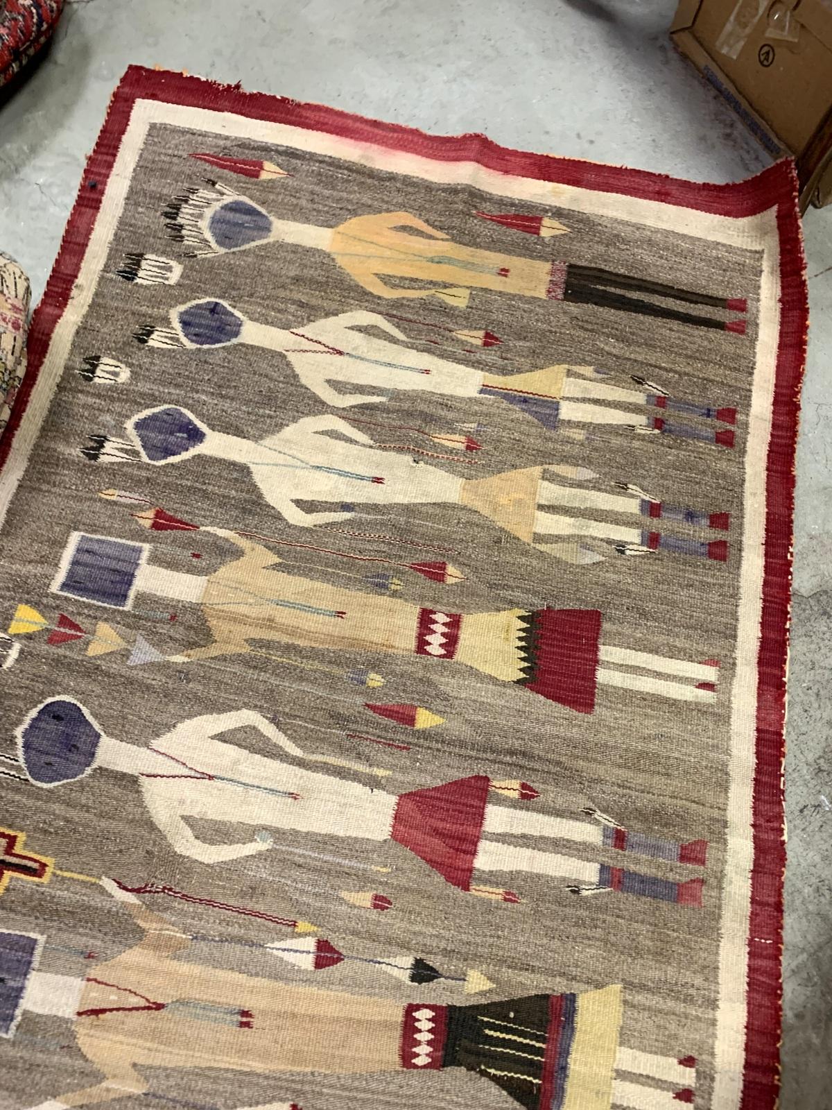 This exquisite handmade antique Navajo Yei rug from the 1900s is a stunning example of Native American craftsmanship. Woven from wool with intricate designs representing Yei figures, the rug reflects both cultural and spiritual significance. Its