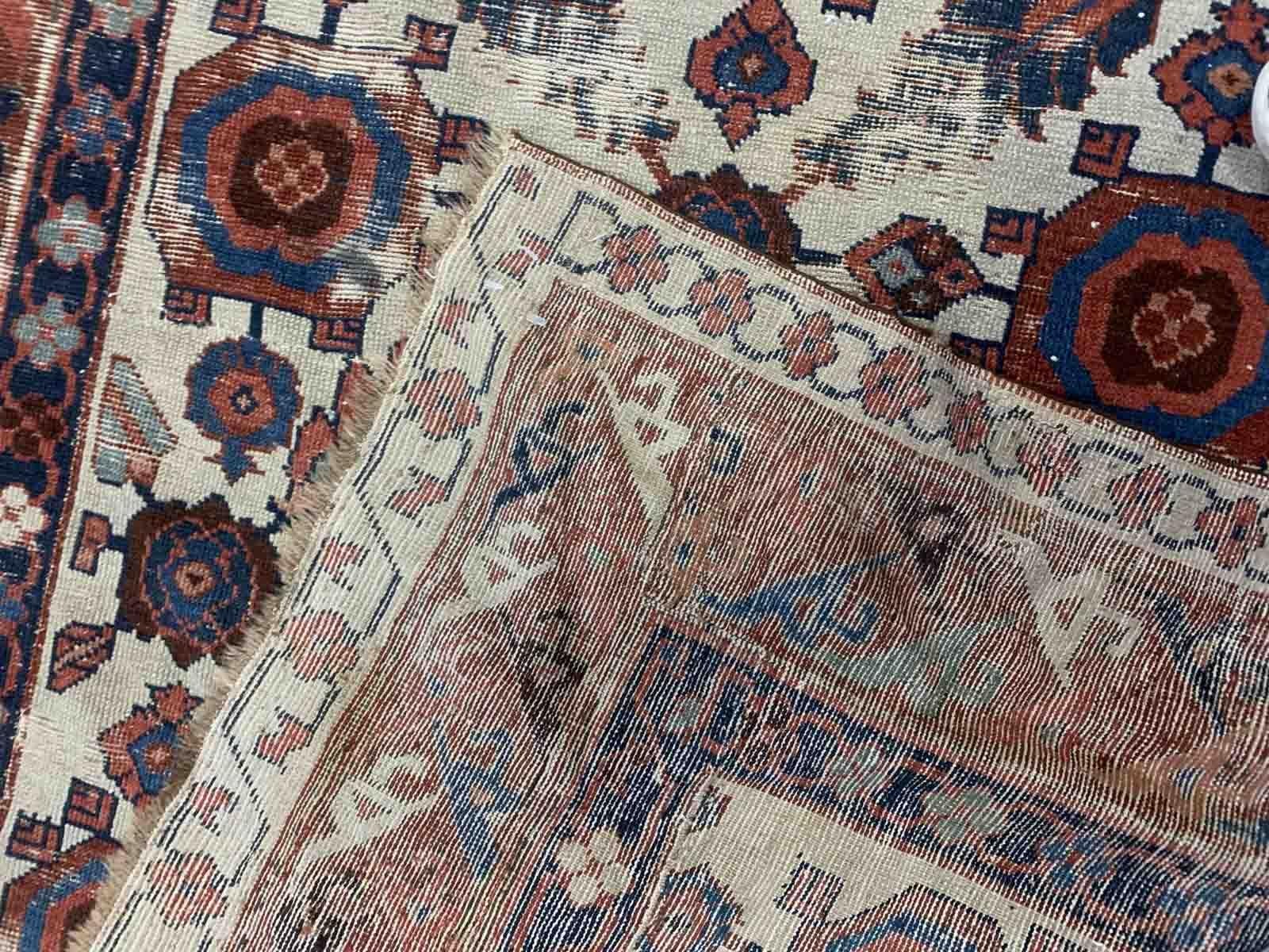 Very old handmade antique North-West Persian rug in white and red background colors. The rug is from the beginning of 19th century in distressed condition. 

-Condition: distressed,

-Circa: 1820s,

-Size: 3.11' x 8' (125cm x