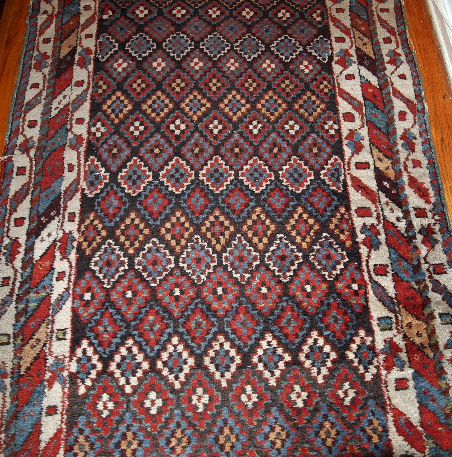 Antique handmade Northwest rug in original good condition from 1880s. The rug made in repeating geometric pattern in colourful shades.

- Condition: original good,

- circa: 1880s,

- Size: 4.2' x 9.1' ( 128cm x 277cm ),

- Material: