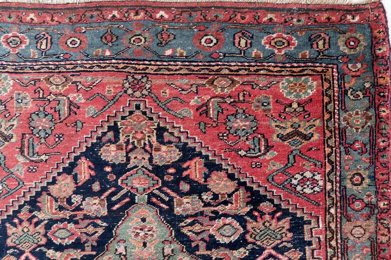 Discover the timeless allure of this Handmade Antique Persian Malayer Rug, a true masterpiece from the 1910s that carries a rich history and artistic tradition.

Key Features:

A Glimpse into the Past: This rug is a window to a bygone era, echoing
