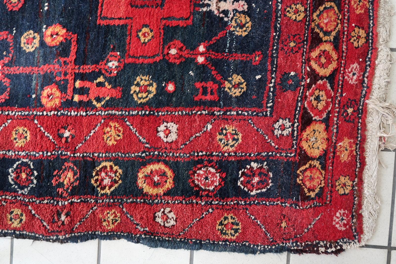 A Glimpse into History with our Antique Persian Hamadan Rug

Transport your living space to a bygone era with our Handmade Antique Persian Hamadan Rug, a true testament to the artistry of the 1930s. Measuring 4.6' x 6.7' (142cm x 205cm), this