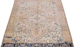 Handmade Antique Persian Heriz Peach Wool Rug with Medallion Motif