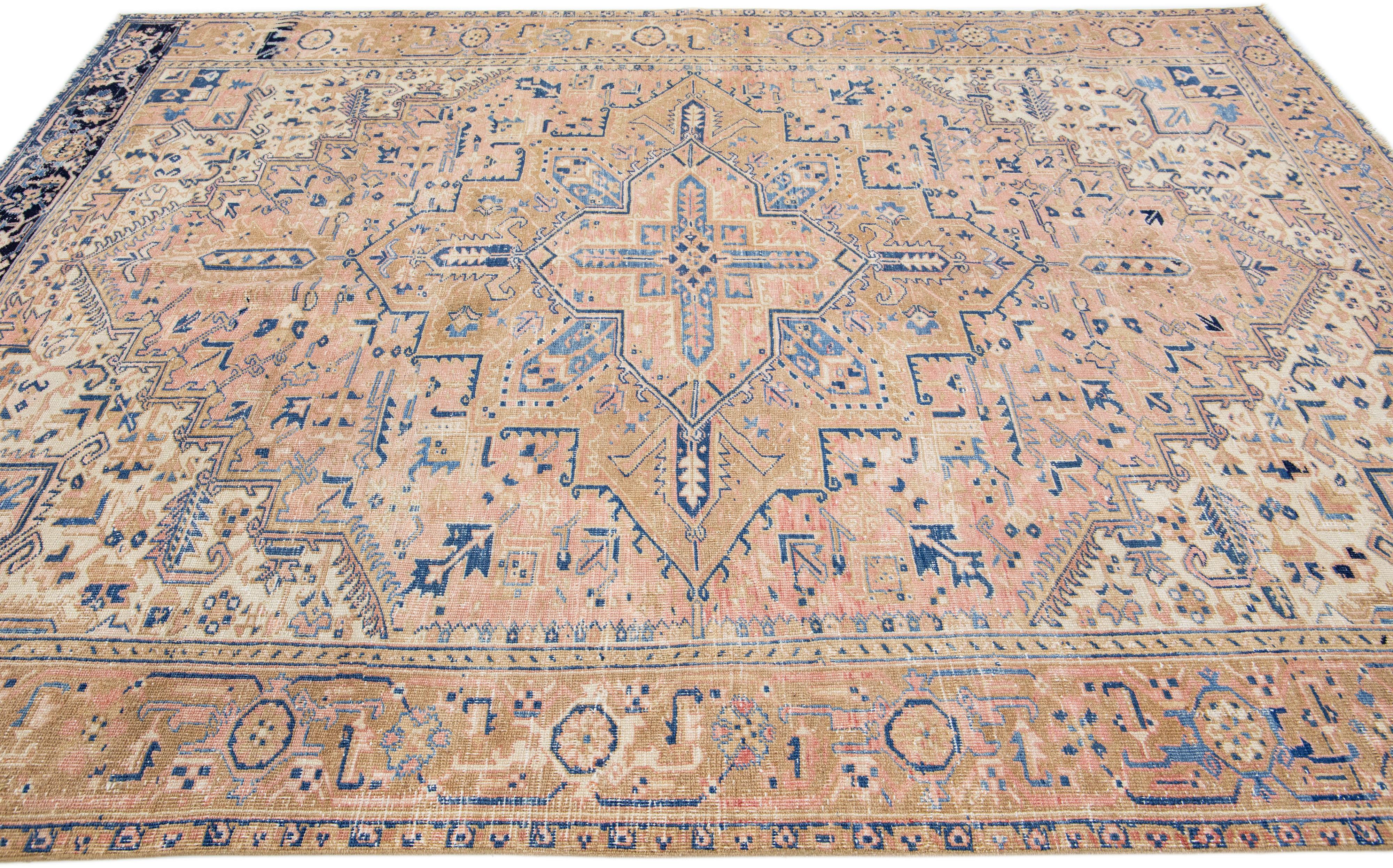 Hand-Knotted Handmade Antique Persian Heriz Peach Wool Rug with Medallion Motif For Sale
