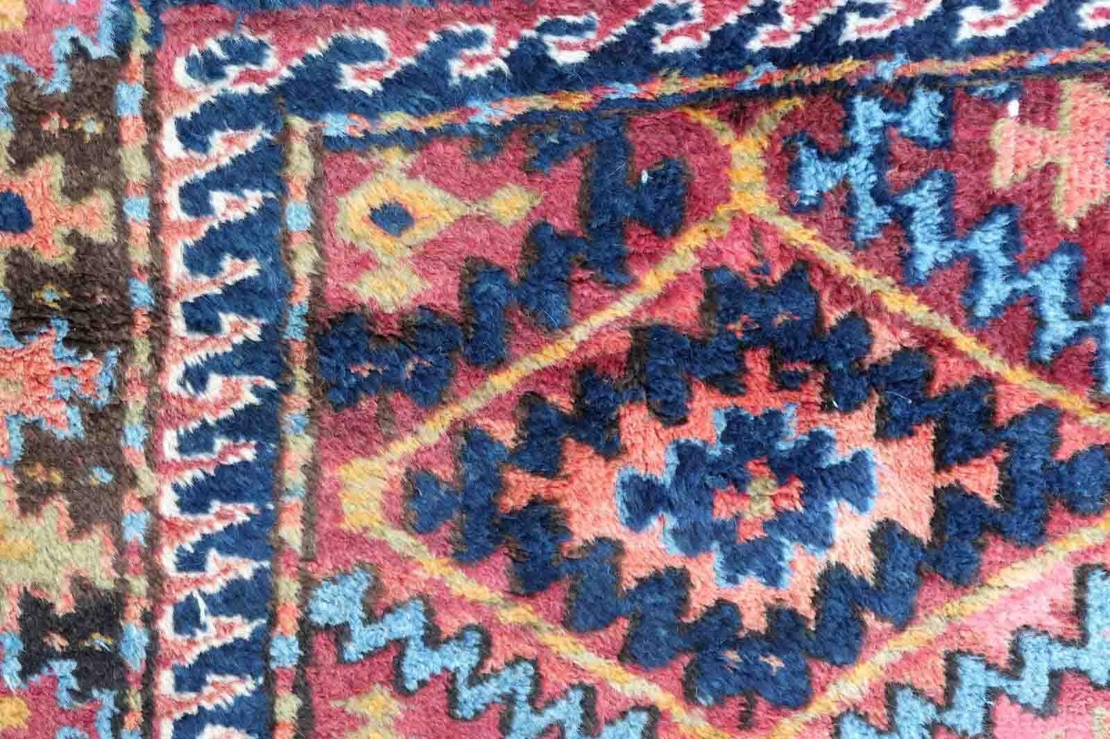 Handmade antique rug from Middle East in Kurdish design. The rug is in colorful repeating pattern and all-over design. It is from the beginning of 20th century in original good condition.

-condition: original good,

-circa: 1920s,

-size: