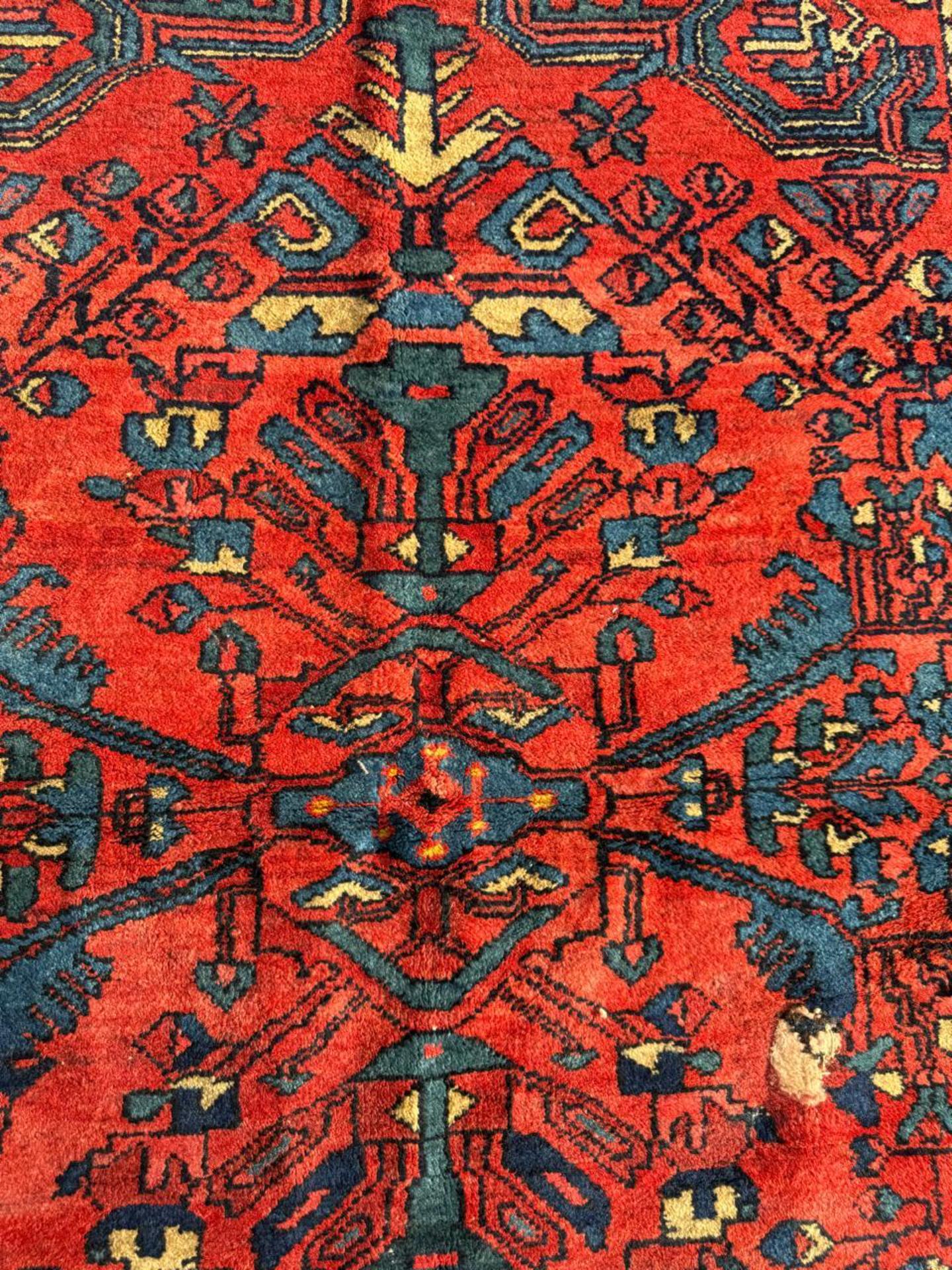 A Burst of Persian Color and Tradition
Introduce a touch of history and timeless artistry with this antique Persian Lilihan rug, hand-knotted from fine, durable wool circa the 1920s. Originating from the Lilihan region, part of the greater Hamadan