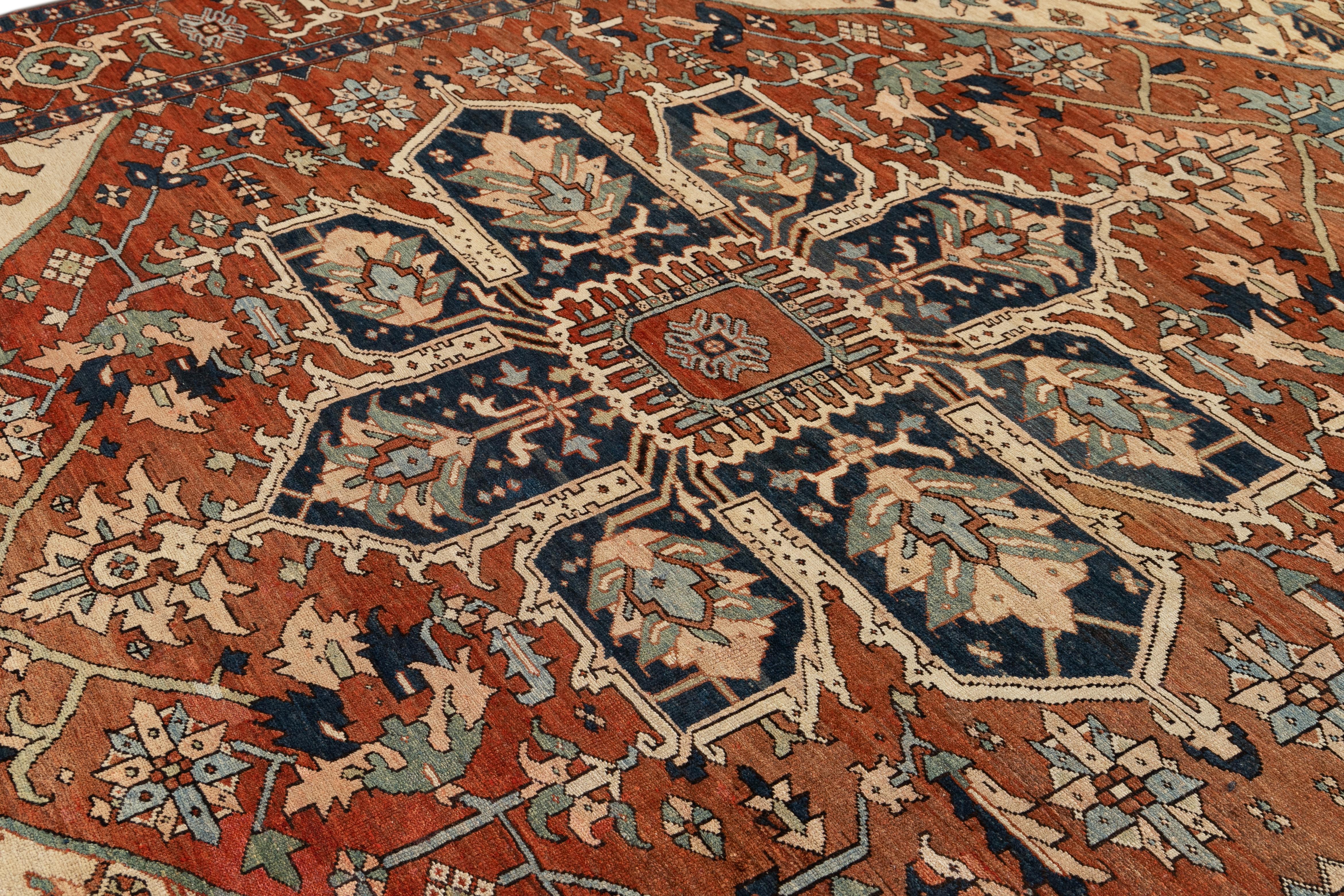 Early 20th Century Handmade Antique Persian Serapi Medallion Wool Rug In Orange- Rust Color  For Sale