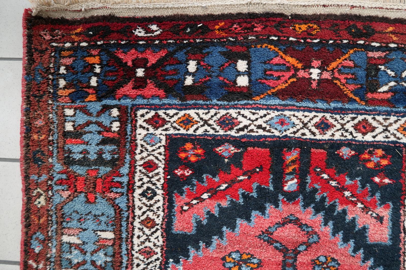Introducing our exquisite Handmade Antique Persian Style Hamadan Runner Rug, a true masterpiece that encapsulates the charm and heritage of the 1920s. Crafted with exceptional care and attention to detail, this rug is in remarkably good condition, a