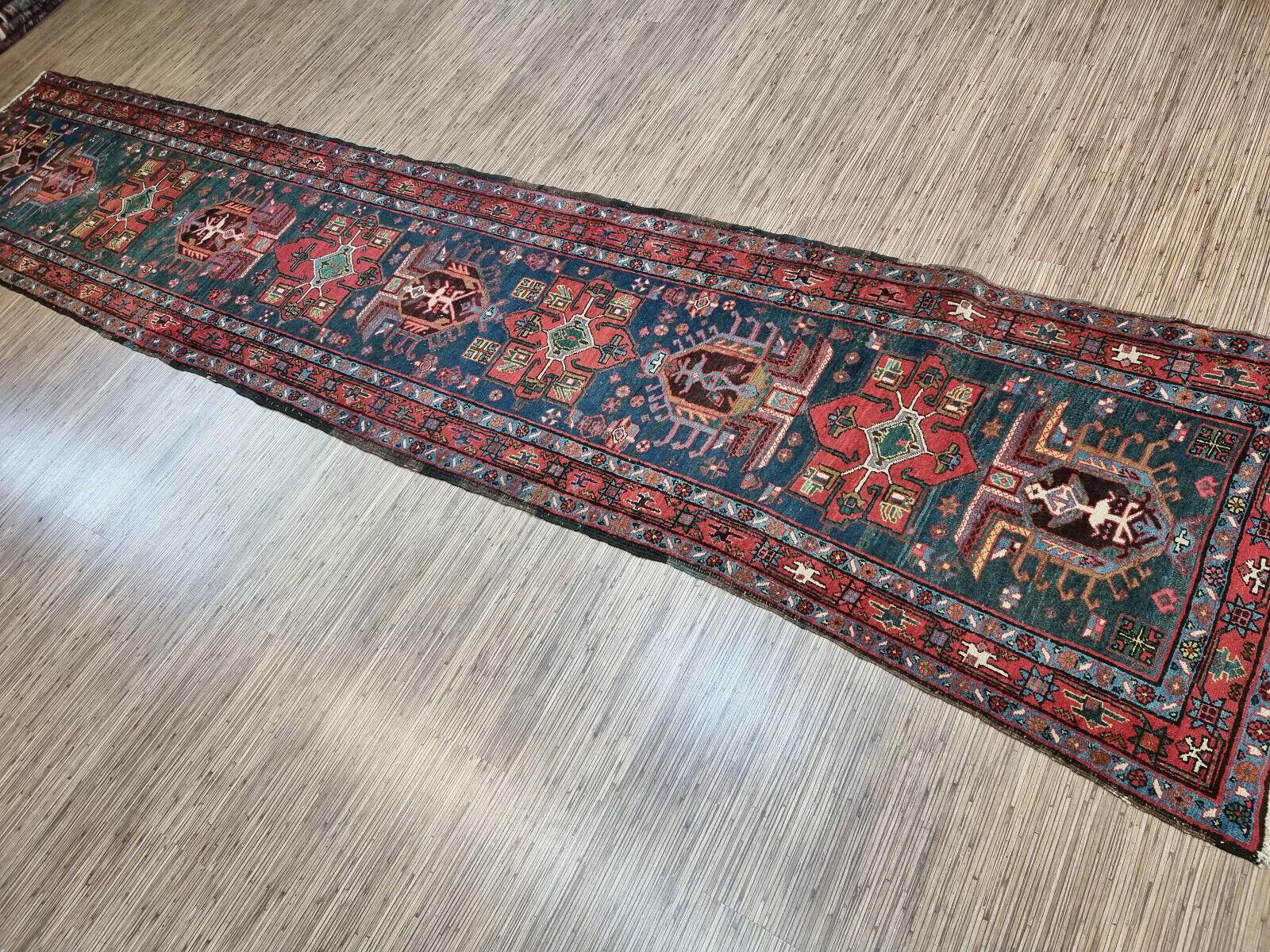 Bring home a piece of history and artistry with this Handmade Antique Persian Style Heriz Runner Rug. This beautiful rug measures 2.8’ x 13.7’ (86cm x 420cm) and dates back to the 1900s, making it a rare and valuable find. It is crafted from