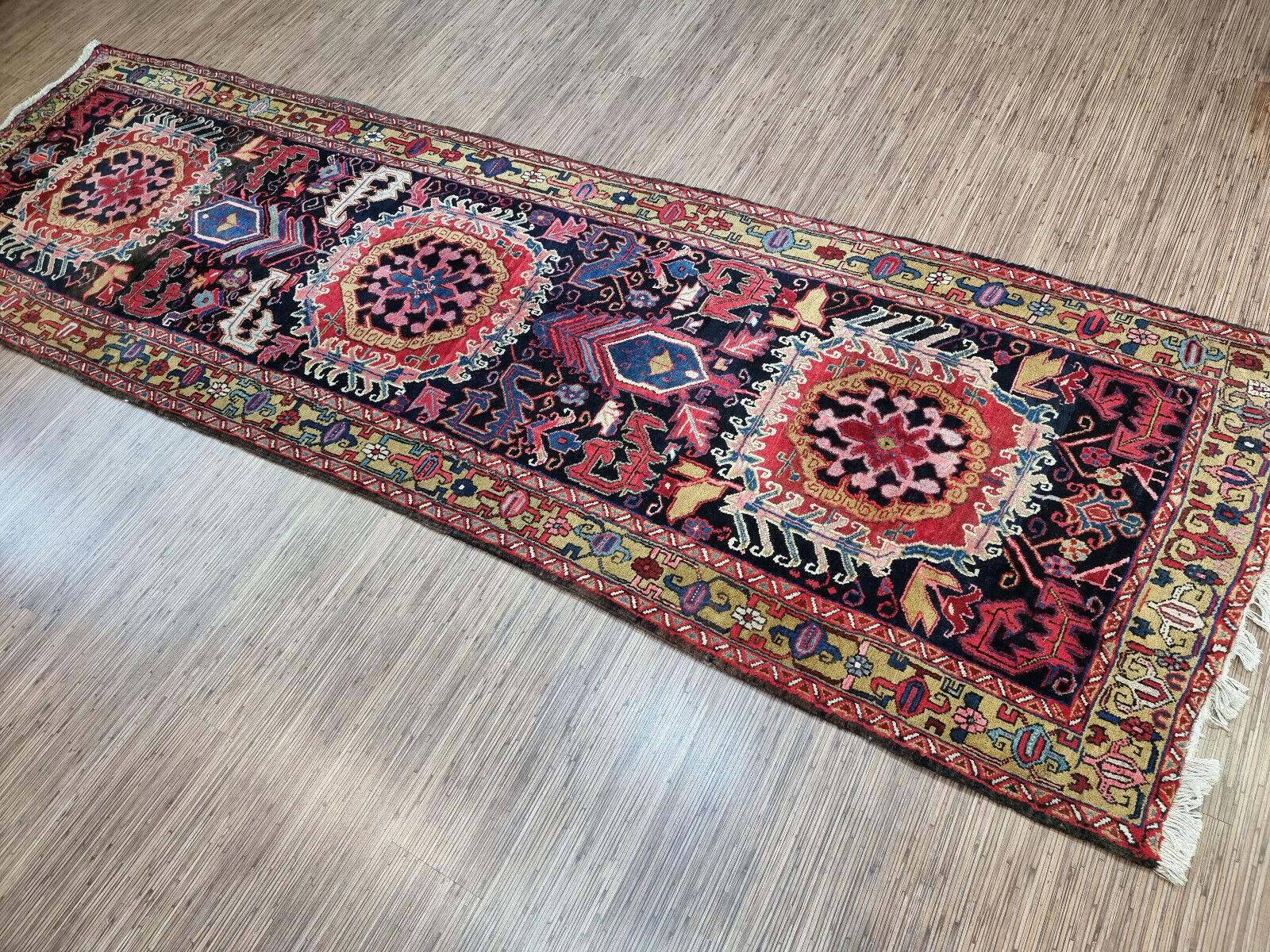 Handmade Antique Persian Style Heriz Runner Rug

Add a touch of history and artistry to your home with this handmade antique Persian style Heriz runner rug. This stunning piece measures 3.7’ x 12.1’ or 114cm x 370cm, making it a long and narrow rug