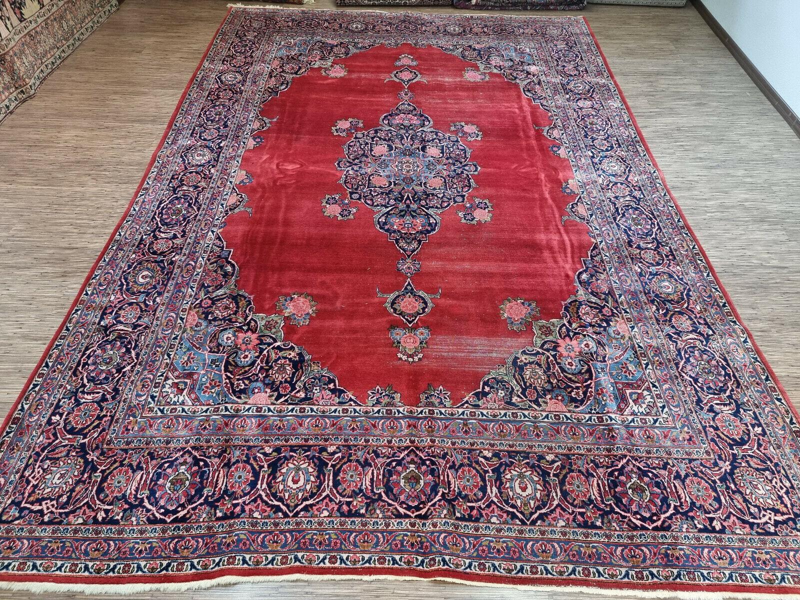 Introduce a touch of timeless elegance to your home with our Handmade Antique Persian Style Kashan Distressed Rug. Measuring at a generous 8.5’ x 12.9’ (260cm x 395cm), this exquisite piece is a testament to the intricate craftsmanship of the