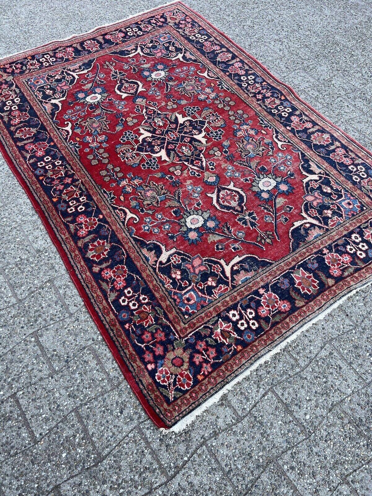 Immerse yourself in the rich history of Persian rug-making with this Handmade Antique Persian Style Kashan Rug. Dating back to the 1920s, this rug measures 4.4’ x 6.5’ (136cm x 200cm) and is a remarkable relic from a bygone era.

The rug is