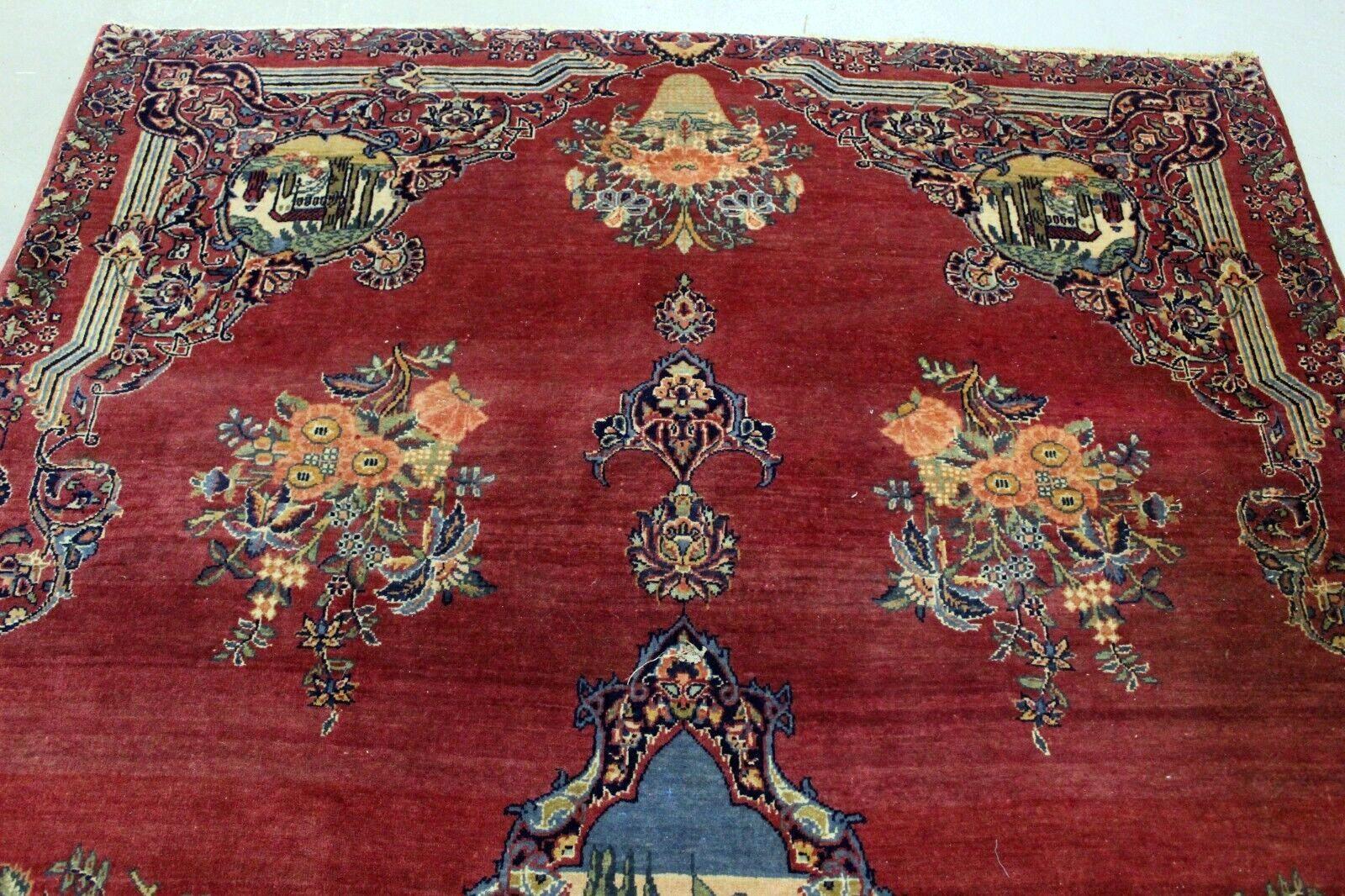  Introducing our exquisite Handmade Antique Persian Style Kerman Rug, a captivating piece that carries the rich heritage of Persian craftsmanship. Measuring approximately 4.3’ x 6.7’ (132cm x 205cm), this rug from the 1920s is meticulously crafted