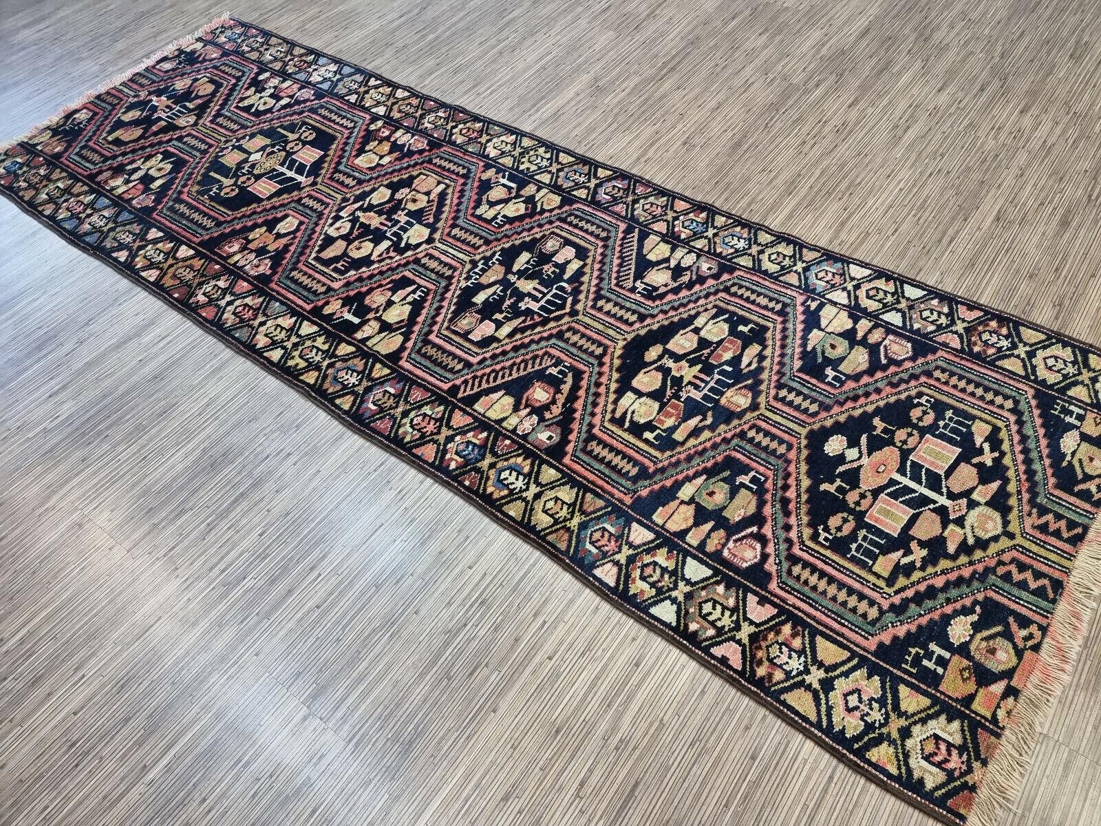 Add a touch of vintage charm to your hallway or living room with our Handmade Antique Persian Style Luri Runner Rug. This stunning piece was woven in the 1920s, showcasing the exquisite craftsmanship and artistry of the Luri tribe from southwestern