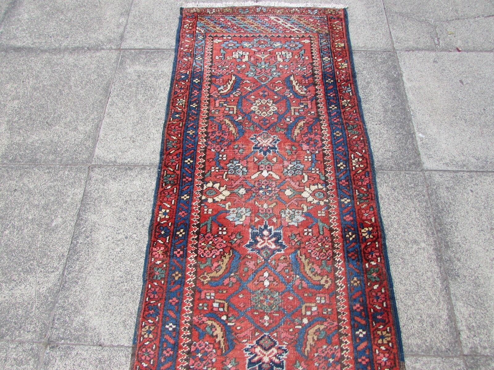 Enhance your home with the enchanting beauty of this Handmade Antique Persian Style Mahal Runner Rug. Dating back to the 1920s, this rug brings a touch of history and artistry to your living space.

Key Features:

Size: Measuring 2.5' x 12.1', this